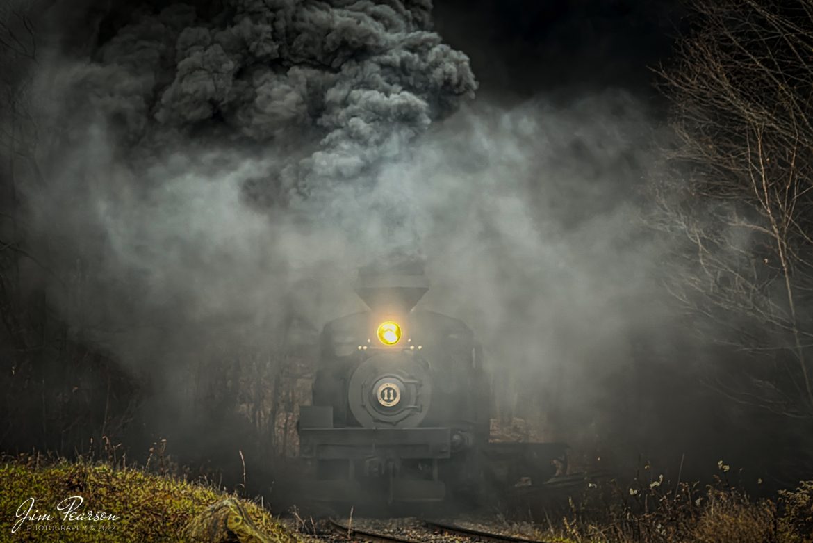 Cass Scenic Railway Shay locomotive number 11, (C-90-3) moves through a cloud of its own smoke as it runs through the forest during the Rail Heritage Photography Weekend photo shoot at Cass, West Virginia on November 5th, 2022. 

According to Wikipedia: Cass Scenic Railroad, is an 11-mile (18 km) long heritage railway owned by the West Virginia State Rail Authority and operated by the Durbin and Greenbrier Valley Railroad. The park also includes the former company town of Cass and a portion of the summit of Bald Knob, the highest point on Back Allegheny Mountain.

Founded in 1901 by the West Virginia Pulp and Paper Company (now WestRock), Cass was built as a company town to serve the needs of the men who worked in the nearby mountains cutting spruce and hemlock for the West Virginia Spruce Lumber Company, a subsidiary of WVP&P. At one time, the sawmill at Cass was the largest double-band sawmill in the world. It processed an estimated 1.25 billion board feet (104,000,000 cu ft; 2,950,000 m3) of lumber during its lifetime. In 1901 work started on the 4 ft 8+1⁄2 in (1,435 mm) standard gauge railroad, which climbs Back Allegheny Mountain. 

The railroad eventually reached a meadow area, now known as Whittaker Station, where a logging camp was established for the immigrants who were building the railroad. The railroad soon reached the top of Gobblers Knob, and then a location on top of the mountain known as 'Spruce'. The railroad built a small town at that location, complete with a company store, houses, a hotel, and a doctor's office. Work soon commenced on logging the red spruce trees, which grew in the higher elevations.

Tech Info: iPhone 14 Pro, f/2.8, 1/75, ISO 64.

#trainphotography #railroadphotography #trains #railways #trainphotographer #railroadphotographer #jimpearsonphotography #cassscenicrailway #steamtrains