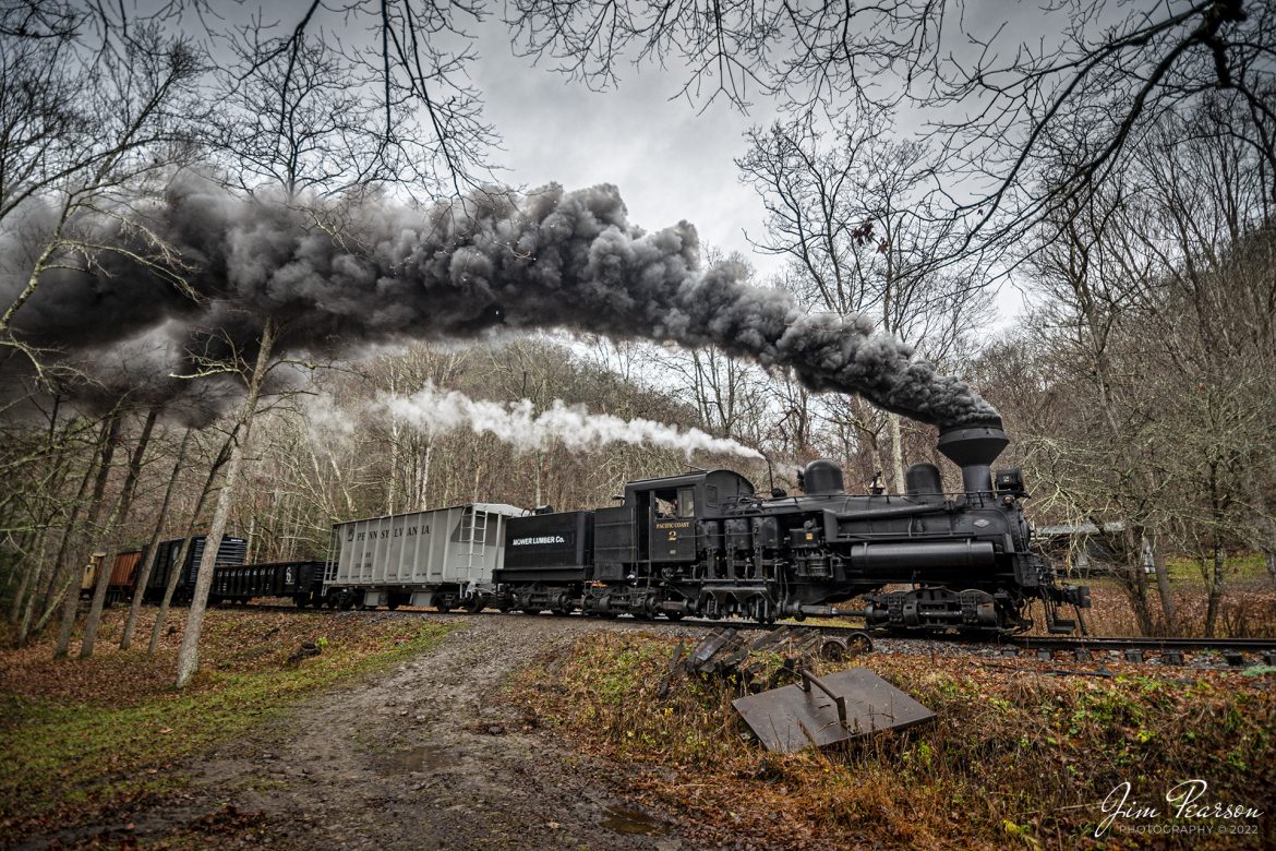 Mower Lumber Company steam locomotive, Shay No. 2, heads through a grade crossing, outside Cass, West Virginia on November 4th, 2022, during the Mountain Rail WV, Rail Heritage Photography Weekend at the Cass Scenic Railroad, Cass, WV, from November 4-6th, 2022. 

According to the Cass website: Shay #2, a Pacific Coast Shay, was constructed in July of 1928 for the Mayo Lumber Company of Paldi, Vancouver Island, British Columbia. A Pacific Coast Shay is a souped-up model of the class C-70 3 truck Shay. The Pacific Coast features superheat, a firebox that is 13 inches longer, lower gear ratio, steel cab, cast steel trucks, and steel girder frame. A feature of the steel girder frame is the large opening for exposing staybolts.

Also, the cylinders were designed so they attached only to the locomotive frame, rather than to the boiler shell as in other Shays. This allowed for easier access and maintenance. #2 is the only Shay of its kind in the east. Shay #2, originally a wood burner, spent its working commercial life with four companies in British Columbia including Lake Logging Company, Cowichan Lake B.C. and Western Forest Industries, Honeymoon Bay, B.C. Later converted to burn oil then rebuilt to burn bituminous coal at Cass, #2 is the only known Shay to have used all three types of fuel. The locomotive ended its career switching cars on Vancouver docks in 1970, making it one of the last commercially used Shays.

Tech Info: Nikon D800, RAW, Nikon 10-24mm @ 11mm, f/2.8, 1/400, ISO 180.

#trainphotography #railroadphotography #trains #railways #trainphotographer #railroadphotographer #jimpearsonphotography #cassscenicrailway #steamtrains