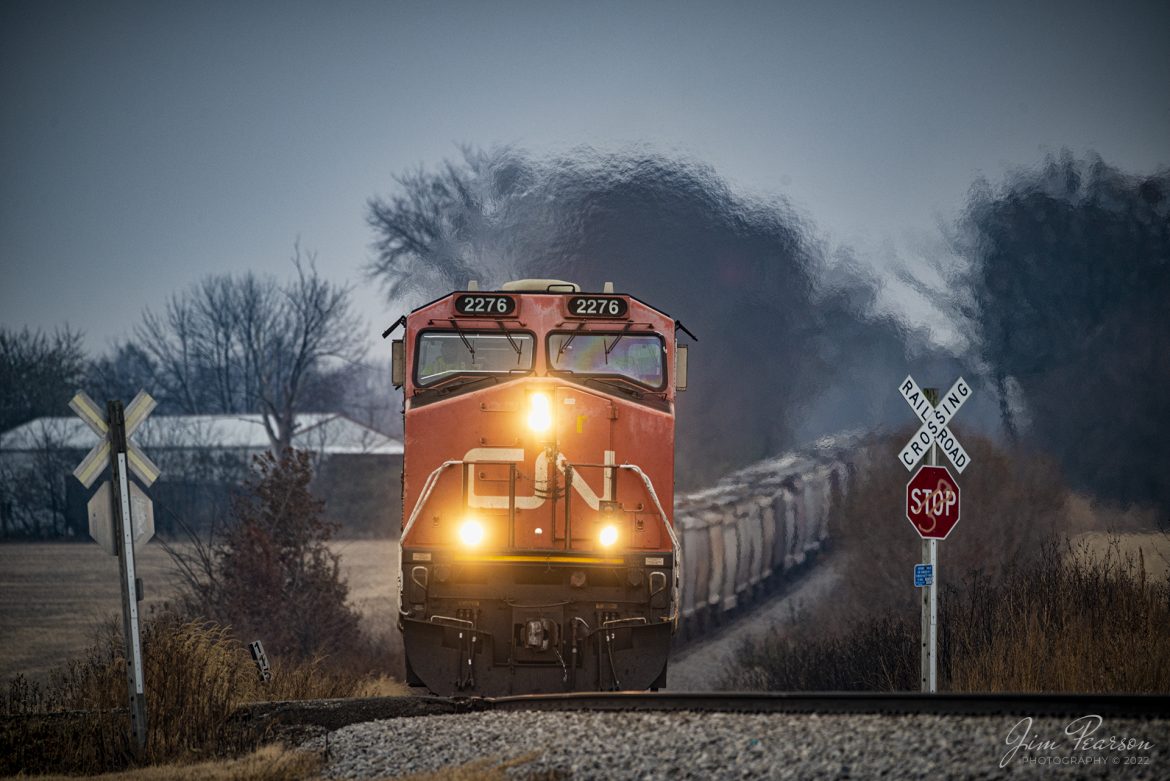 Canadian National 2276 leads GLCNTH25, a loaded grain train, as they head north on the Indiana Railroad's Indianapolis Subdivision heading through the crossing just past Milepost 115, just north of Sullivan, Indiana on November 25th, 2022.

Tech Info: Nikon D800, RAW, Sigma 150-600 @ 600mm, f/6.3, 1/640, ISO 1000.

#trainphotography #railroadphotography #trains #railways #jimpearsonphotography #trainphotographer #railroadphotographer #regionalrailroad