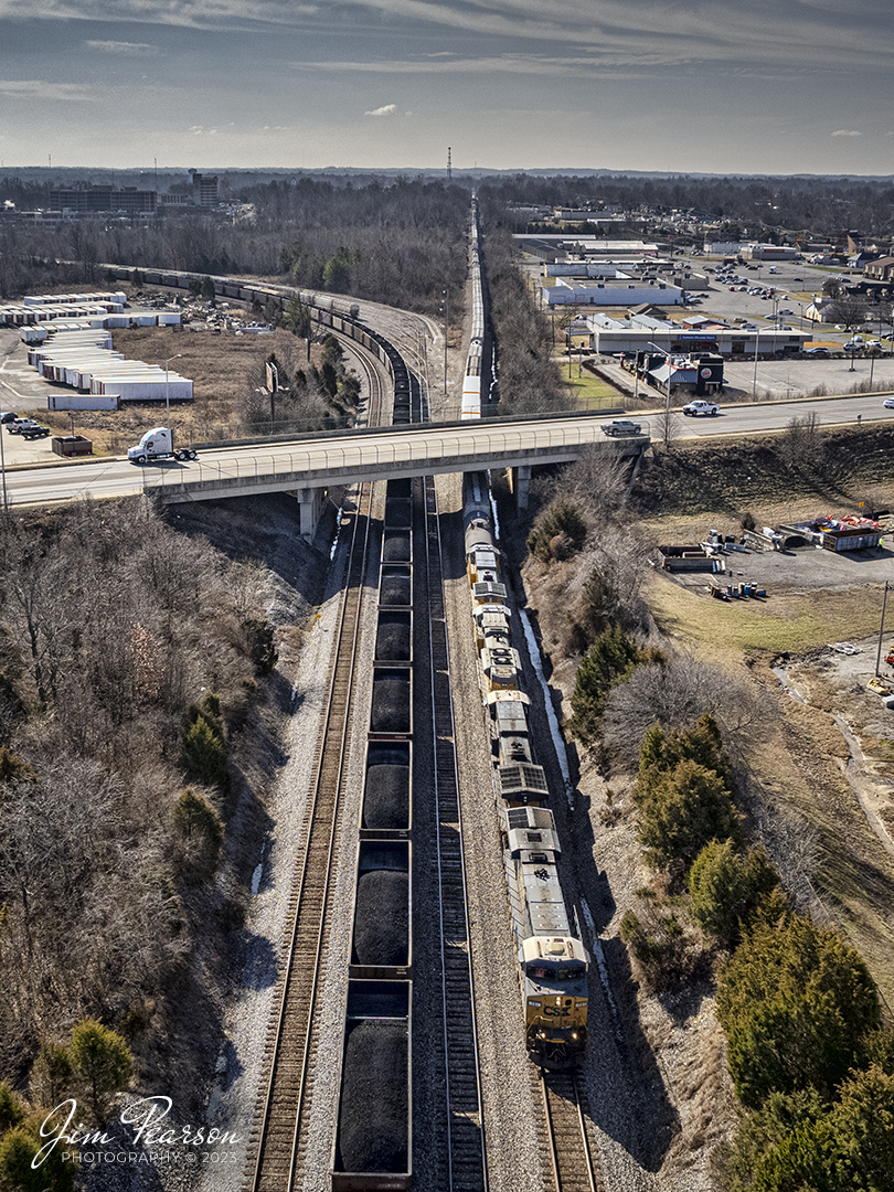 CSXT 701 Leads northbound manifest X502, as it passes under the Island Ford Road overpass at Madisonville, Ky, as it passes CSX Atkinson Yard on January 24th, 2023, on the Henderson Subdivision.

Tech Info: DJI Mavic Air 2S Drone, RAW, 22mm, f/2.8, 1/2500, ISO 100.

#trainphotography #railroadphotography #trains #railways #dronephotography #trainphotographer #railroadphotographer #jimpearsonphotography #trainsfromtheair #csxhendersonsubdivision #kentuckytrains
