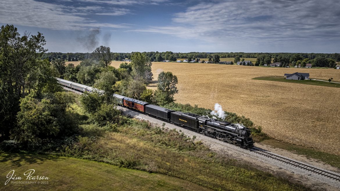 Nickel Plate Road (NKP) 765 leads the American History Train as they begin to run out of Pleasant Lake, Indiana along the Indiana Northeastern Railroad, as they head back to Angola, Indiana to pick up another load of passengers on September 24th, 2022.

NKP 765 was pulling the American History Train between Pleasant Lake from Angola, Indiana during the annual American History Days Festival. It took guests back to the 1940s for a living history experience. The passengers then got a 45-minute layover at Pleasant Lake where they visited with WWII reenactors, listened to live music and much more.

According to Wikipedia: Nickel Plate Road 765 is a class "S-2" 2-8-4 "Berkshire" type steam locomotive built for the New York, Chicago & St. Louis Railroad, commonly referred to as the "Nickel Plate Road".

No. 765 continues to operate in mainline excursion service and is owned and maintained by the Fort Wayne Railroad Historical Society and was also added to the National Register of Historic Places on September 12, 1996.

Tech Info: DJI Mavic Air 2S Drone, 22mm, f/2.8, 1/3000, ISO 130.

#trainphotography #railroadphotography #trains #railways #dronephotography #trainphotographer #railroadphotographer #jimpearsonphotography #nkp765 #steamtrain