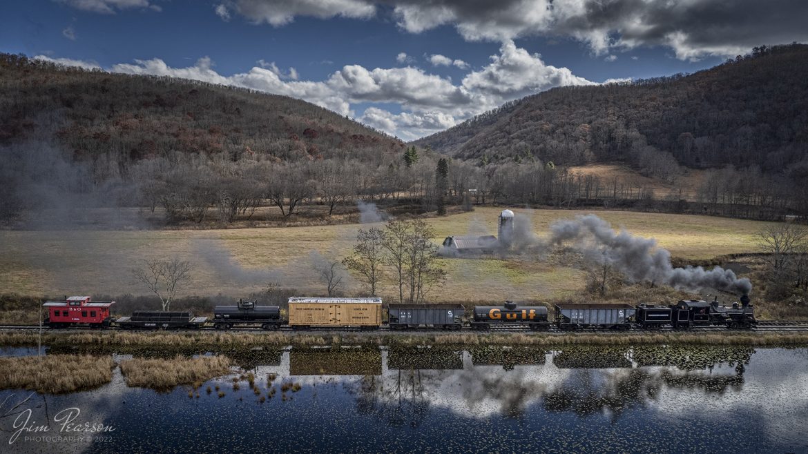 Meadow River Lumber Company steam locomotive, Heisler No. 6, leads a freight train past a wetlands area at Hosterman, West Virginia during the Mountain Rail WV, Rail Heritage Photography Weekend. The event was held at the Durbin & Greenbrier Valley Railroad, Durbin, WV, and Cass Scenic Railroad, Cass, WV, from November 4-6th, 2022. 

According to Wikipedia: The Durbin and Greenbrier Valley Railroad (reporting mark DGVR) is a heritage and freight railroad in the U.S. states of Virginia and West Virginia. It operates the West Virginia State Rail Authority-owned Durbin Railroad and West Virginia Central Railroad (reporting mark WVC), as well as the Shenandoah Valley Railroad in Virginia.

Beginning in 2015, DGVR began operating the historic geared steam-powered Cass Scenic Railroad, which was previously operated by the West Virginia Division of Natural Resources as part of Cass Scenic Railroad State Park.

Tech Info: DJI Mavic Air 2S Drone, 22mm, f/2.8, 1/2000, ISO 100.

#trainphotography #railroadphotography #trains #railways #dronephotography #trainphotographer #railroadphotographer #jimpearsonphotography #cassscenicrailway #durbinandgreenbriervalleyrr #trainsfromtheair	#steamtrains