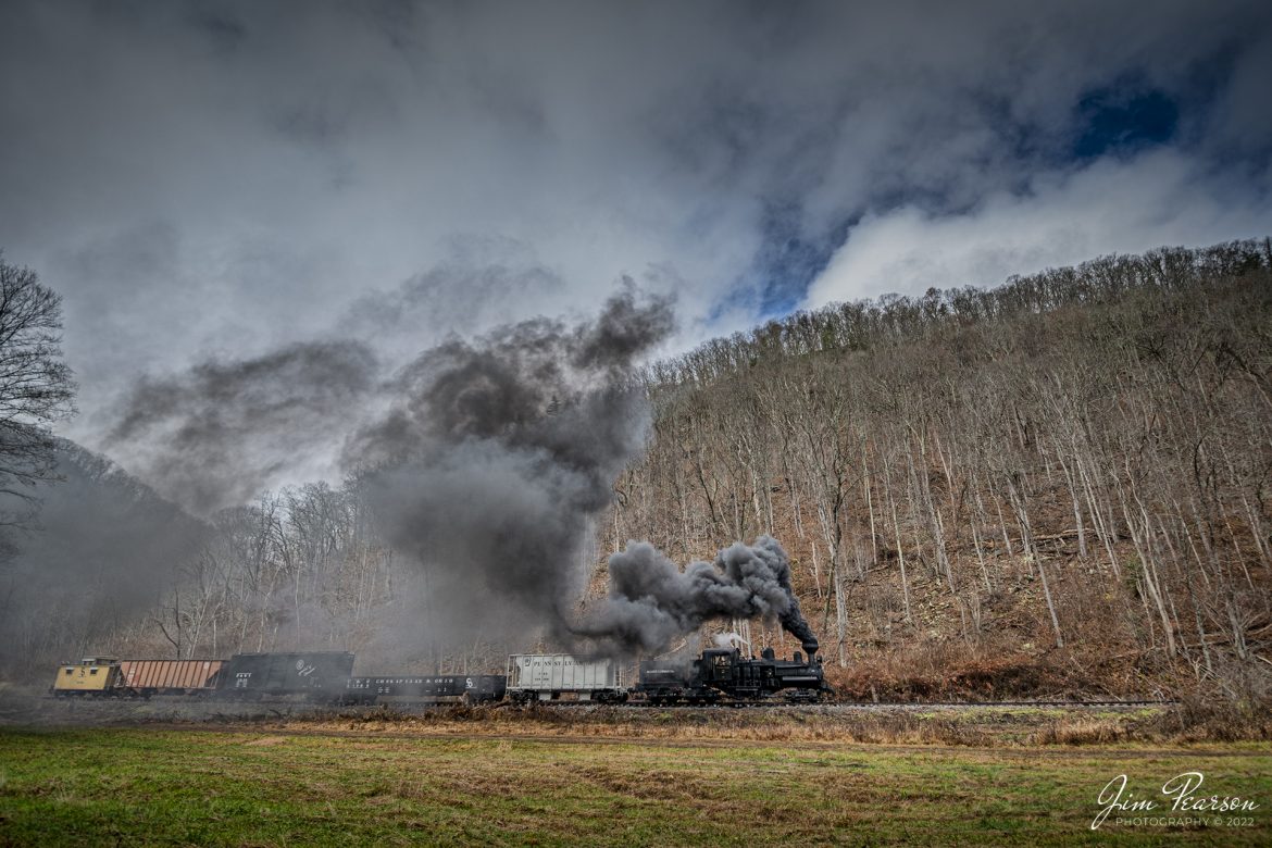 Mower Lumber Company steam locomotive, Shay No. 2, heads through the countryside, outside Cass, West Virginia, with a short freight train, on November 6th, 2022, during the Mountain Rail WV, Rail Heritage Photography Weekend at the Cass Scenic Railroad, Cass, WV, from November 4-6th, 2022. 

According to the Cass website: Shay #2, a Pacific Coast Shay, was constructed in July of 1928 for the Mayo Lumber Company of Paldi, Vancouver Island, British Columbia. A Pacific Coast Shay is a souped-up model of the class C-70 3 truck Shay. The Pacific Coast features superheat, a firebox that is 13 inches longer, lower gear ratio, steel cab, cast steel trucks, and steel girder frame. A feature of the steel girder frame is the large opening for exposing stay bolts.

Also, the cylinders were designed so they attached only to the locomotive frame, rather than to the boiler shell as in other Shays. This allowed for easier access and maintenance. #2 is the only Shay of its kind in the east. Shay #2, originally a wood burner, spent its working commercial life with four companies in British Columbia including Lake Logging Company, Cowichan Lake B.C. and Western Forest Industries, Honeymoon Bay, B.C. Later converted to burn oil then rebuilt to burn bituminous coal at Cass, #2 is the only known Shay to have used all three types of fuel. The locomotive ended its career switching cars on Vancouver docks in 1970, making it one of the last commercially used Shays.

Tech Info: Nikon D800, RAW, Nikon 10-24mm @ 11mm, f/2.8, 1/640, ISO 140.

#trainphotography #railroadphotography #trains #railways #trainphotographer #railroadphotographer #jimpearsonphotography #cassscenicrailway #steamtrains