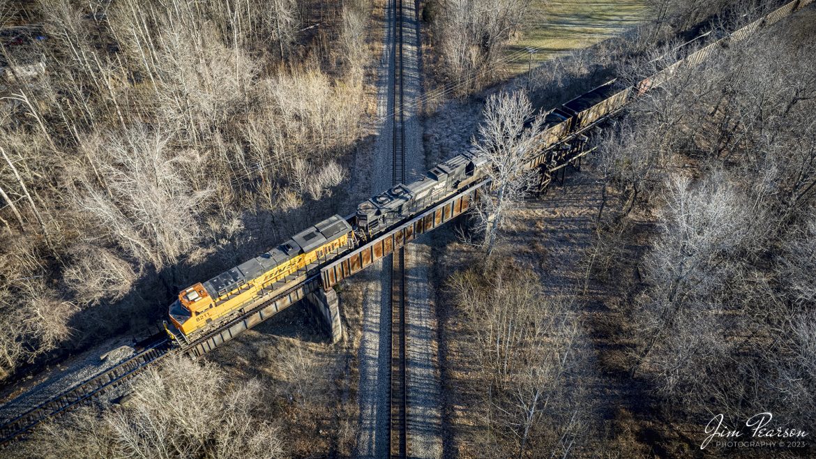BNSF 8211 and NS 1075 bring up the rear of a loaded Norfolk Southern coal train as it heads north on the Paducah and Louisville Railway line at Madisonville, Kentucky on January 24th, 2023. The line and train is crossing over the location referred to as Monarch on the CSX Henderson Subdivision at Madisonville. 

Tech Info: DJI Mavic Air 2S Drone, RAW, 22mm, f/2.8, 1/320, ISO 140.

#trainphotography #railroadphotography #trains #railways #dronephotography #trainphotographer #railroadphotographer #jimpearsonphotography #trainsfromtheair #csxhendersonsubdivision #kentuckytrains