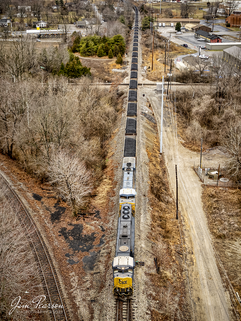 CSX C002 crosses over the diamond at Trident on the Henderson Subdivision, after coming off the Morganfield Branch after picking up a load of coal from Warrior Coal mine, as they head into CSX Atkinson Yard at Madisonville, Ky on January 25th, 2023. 

Tech Info: DJI Mavic Air 2S Drone, RAW, 22mm, f/2.8, 1/100, ISO 100.

#trainphotography #railroadphotography #trains #railways #dronephotography #trainphotographer #railroadphotographer #jimpearsonphotography #trainsfromtheair #csxhendersonsubdivision #kentuckytrains