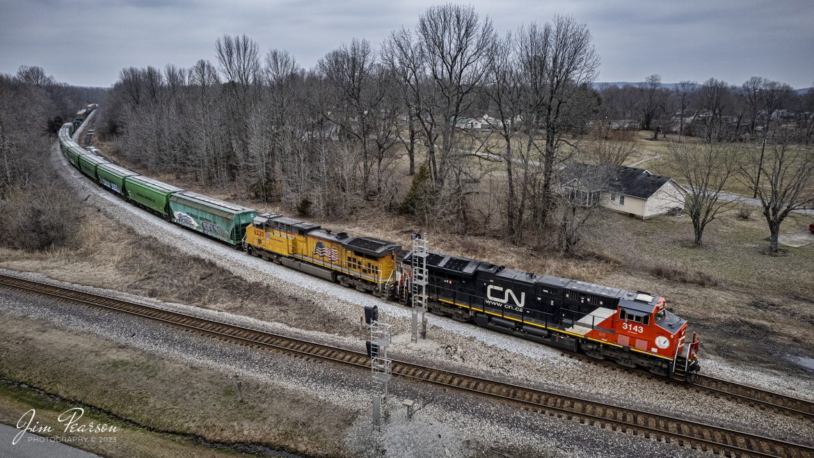 Canadian National 3143 and Union Pacific 6220 pull CSX M513 off the Earlington Cuttoff at Mortons Gap, Kentucky as the head south on the Henderson Subdivision on February 10th, 2023.

Tech Info: DJI Mavic Air 2S Drone, 22mm, f/2.8, 1/640, ISO 200.

#trainphotography #railroadphotography #trains #railways #dronephotography #trainphotographer #railroadphotographer #jimpearsonphotography #csx #trainsfromadrone #kentuckytrains #cnrailway #uprailway