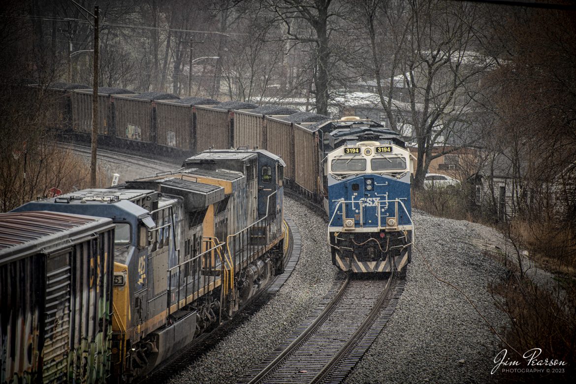 CSXT 3194 Honoring Law Enforcement Locomotive, leads loaded coal train, C321 through the rain, as it sits on track one at Nortonville, Kentucky, as the Casky Yard Turn passes on track two, heading north on the CSX Henderson Subdivision on March 3rd, 2023.

CSX C321 would go on to eventually tie down at this location due to heavy rains and winds that passed through the region causing havoc on the Henderson Subdivision between Hopkinsville, Ky and Nashville, TN with MOW crews having to clear over 130 trees from the right-of-way before thru trains would start moving again the next day.

Tech Info: Nikon D800, RAW, Nikon 70-300 @ 230mm, f/5.6, 1/250, ISO 360.

#trainphotography #railroadphotography #trains #railways #jimpearsonphotography #trainphotographer #railroadphotographer #csxhendersonsubdivision #trainsintherain