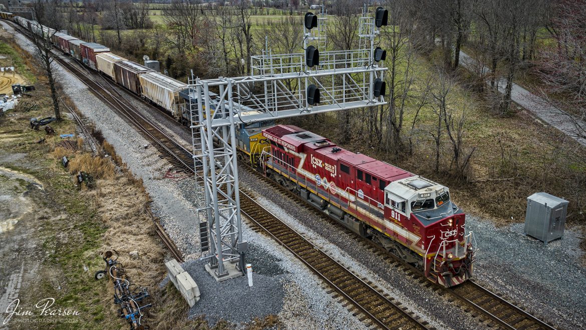 Northbound CSX M648 passes under the north end of Anaconda at Robards, Kentucky with the CSXT 911, Honoring First Responders locomotive leading, on the Henderson Subdivision on March 9th, 2023.

CSXT 911 is painted in vibrant red with white and gold striped accents along with the logo of program partners First Responders Childrens Foundation and Operation Gratitude. It also features generic police, fire and emergency medical services logos.

Tech Info: DJI Mavic 3 Classic Drone, RAW, 24mm, f/2.8, 1/640, ISO 140.

#trainphotography #railroadphotography #trains #railways #dronephotography #trainphotographer #railroadphotographer #jimpearsonphotography #kentuckytrains #csx #csxrailway #csxhendersonsubdivision #RobardsKy #mavic3classic #drones #trainsfromtheair #trainsfromadrone
