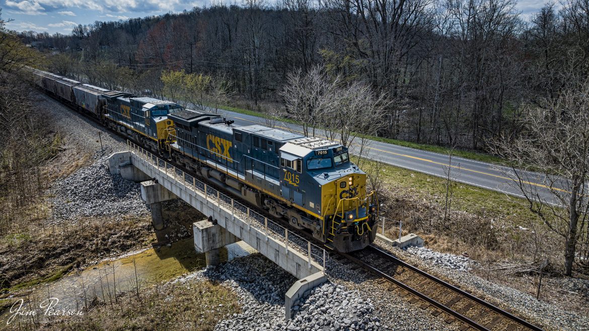 CSX 7015 leads CSX B231 passes over a short bridge at  Mortons Gap, Ky, with a train of Phosphate Loads, as it heads north on March 18th, 2023. The loads run from Mulberry, FL, to Bensenville, IL (CP) via the Henderson Subdivision.

Tech Info: DJI Mavic 3 Classic Drone, RAW, 24mm, f/2.8, 1/2000, ISO 280.

#trainphotography #railroadphotography #trains #railways #dronephotography #trainphotographer #railroadphotographer #jimpearsonphotography #kentuckytrains #csx #csxrailway #csxhendersonsubdivision #mavic3classic #drones #trainsfromtheair #trainsfromadrone #MortonsGapKy