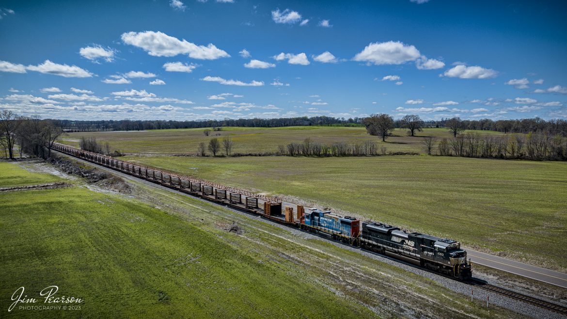 Norfolk Southern 1053 and Grand Trunk 5860 in original paint, lead and empty rail train through the countryside between Union City, TN and Fulton, Ky as they head north on the CN Fulton Subdivision, on March 25th, 2023.

Tech Info: DJI Mavic 3 Classic Drone, RAW, 24mm, f/2.8, 1/2500, ISO 110.

#trainphotography #railroadphotography #trains #railways #dronephotography #trainphotographer #railroadphotographer #jimpearsonphotography #kentuckytrains #csx #csxrailway #csxhendersonsubdivision #BretonKy #mavic3classic #drones #trainsfromtheair #trainsfromadrone