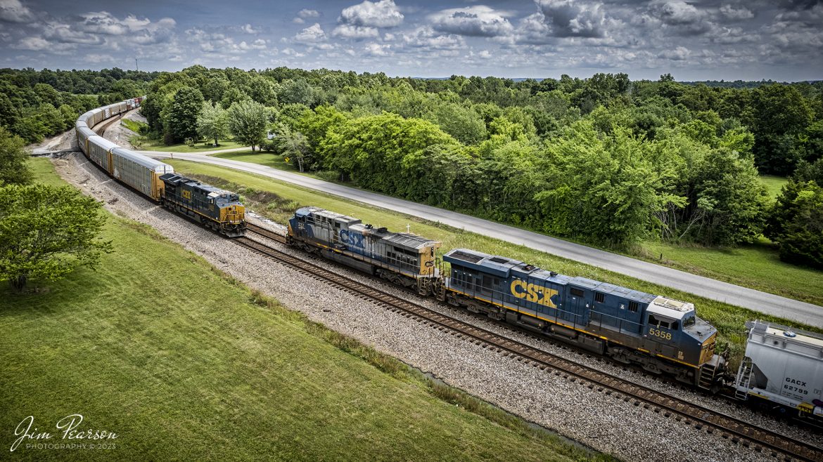 A southbound CSX I025, with a string of autoracks carrying Tesla’s, passes through the North end of Kelly, Ky as it meets M648 waiting in the siding for them to pass through on June 8th, 2022, on the Henderson Subdivision.

Tech Info: DJI Mavic Air 2S Drone, RAW, 22mm, f/2.8, 1/2000, ISO 120.

#trainphotography #railroadphotography #trains #railways #dronephotography #trainphotographer #railroadphotographer #jimpearsonphotography
