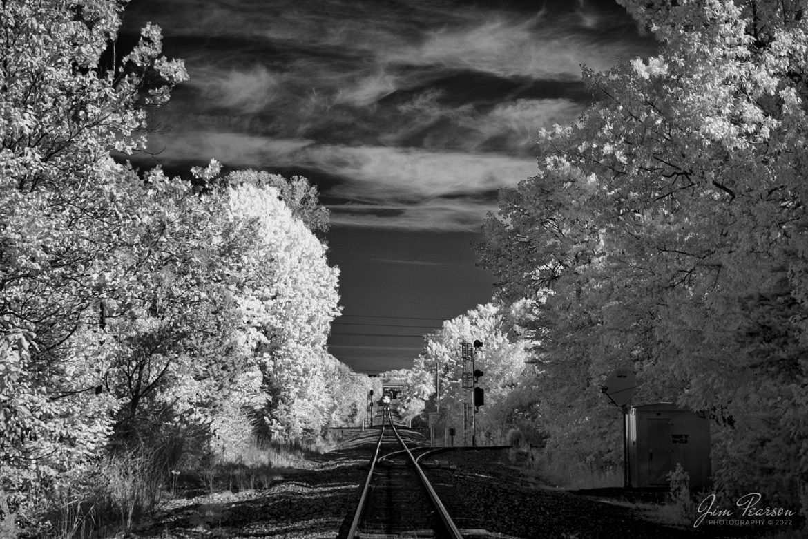 This weeks Saturday Infrared photo is of CSX M513 as it makes its way south on the CSX Henderson Subdivision on October 10th, 2023, as it heads under the Island Ford Road overpass at Madisonville, Ky. Note that this image was shot while the train was still over ½ mile from the crossing, taking not much more time that it would take one to walk past the crossing, with a 24mm wide angle lens.

Tech Info: Fuji XT-1, RAW, Converted to 720nm B&W IR, Nikon 10-24 @ 24mm, f/4.5, 1/250, ISO 200.

#trainphotography #railroadphotography #trains #railways #jimpearsonphotography #infraredtrainphotography #infraredphotography #trainphotographer #railroadphotographer #cassscenicrailway #steamtrains