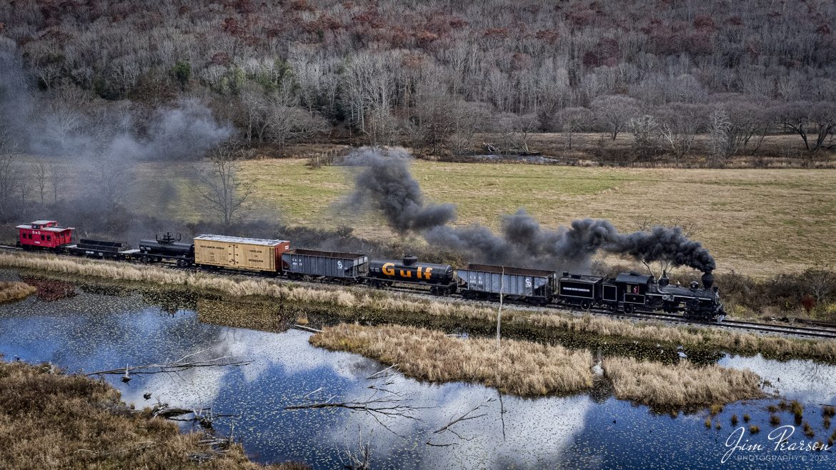 Meadow River Lumber Company steam locomotive, Heisler No. 6, leads a freight train past a wetlands area at Hosterman, West Virginia during the Mountain Rail WV, Rail Heritage Photography Weekend. The event was held at the Durbin & Greenbrier Valley Railroad, Durbin, WV, and Cass Scenic Railroad, Cass, WV, from November 4-6th, 2022. 

According to Wikipedia: The Durbin and Greenbrier Valley Railroad (reporting mark DGVR) is a heritage and freight railroad in the U.S. states of Virginia and West Virginia. It operates the West Virginia State Rail Authority-owned Durbin Railroad and West Virginia Central Railroad (reporting mark WVC), as well as the Shenandoah Valley Railroad in Virginia.

Beginning in 2015, DGVR began operating the historic geared steam-powered Cass Scenic Railroad, which was previously operated by the West Virginia Division of Natural Resources as part of Cass Scenic Railroad State Park.

Tech Info: DJI Mavic Air 2S Drone, 22mm, f/2.8, 1/2000, ISO 100.

#trainphotography #railroadphotography #trains #railways #dronephotography #trainphotographer #railroadphotographer #jimpearsonphotography #cassscenicrailway #durbinandgreenbriervalleyrr #trainsfromtheair #steamtrains
