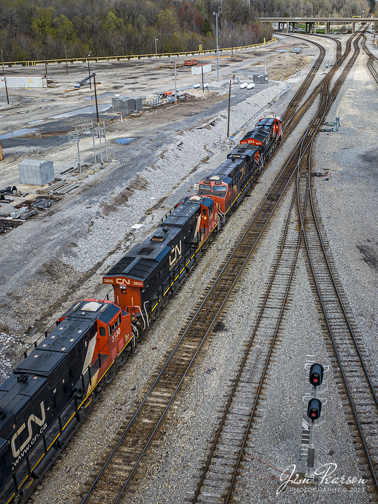 Canadian National 3270 leads four units on a mixed freight as it pulls out of the yard at Fulton, Ky after a crew change, as they head north up the CN Cairo Subdivision, on March 25th, 2023. 

Im told that on average 40-60 trains a day pass through Fulton, Ky, making it a busy place! Railfanning is best in the morning and the afternoon into the evening. The CN Cairo, CN Fulton Subdivisions and the West Tennessee Railroad all come together here at Fulton. Also, Amtrak has a depot here and is a flag stop for the City of New Orleans, and is an unstaffed station; with no agent and no assistance.

The first railroad deed was sold in 1857, and construction reached Pontotoc in 1859. At that time Fulton was referred to as the end of the line by the United States Government and all mail was addressed to this extent. In 1896, the Illinois Central Railroad owned the two railroad lines that crossed Fulton, which saw 30 passenger trains a day and 3,000 freight cars that picked up or delivered cargo. The freight cars would usually have bananas that would stop in Fulton to be re-iced and then shipped to rest of the country. Through this process, Fulton became known as the Banana Capital of the World.

Tech Info: DJI Mavic 3 Classic Drone, RAW, 24mm, f/2.8, 1/800, ISO 100.

#trainphotography #railroadphotography #trains #railways #dronephotography #trainphotographer #railroadphotographer #jimpearsonphotography #kentuckytrains #csx #csxrailway #FultonKy #mavic3classic #drones #trainsfromtheair #trainsfromadrone