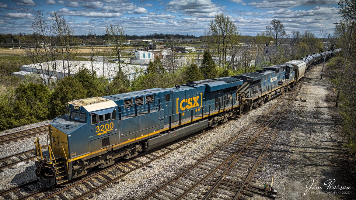 CSXT 3200 and BCRAIL 4648 lead CSX B744, a combined empty ethanol and coal train, into the south end of CSX Atkinson Yard in Madisonville, Ky on April 3rd, 2023, on the Henderson Subdivision. This is where the crew dropped off the coal half of their train before continuing their move north.

According to Wikipedia: BC Rail is a railway in the Canadian province of British Columbia. Chartered as a private company in 1912 as the Pacific Great Eastern Railway, it was acquired by the provincial government in 1918. In 1972 it was renamed to the British Columbia Railway, and in 1984 it took on its present name of BC Rail.

Tech Info: DJI Mavic 3 Classic Drone, RAW, 24mm, f/2.8, 1/2000, ISO 110.

#trainphotography #railroadphotography #trains #railways #dronephotography #trainphotographer #railroadphotographer #jimpearsonphotography #kentuckytrains #csx #csxrailway #HopkinsvilleKy #mavic3classic #drones #trainsfromtheair #trainsfromadrone #csxhendersonsubdivison