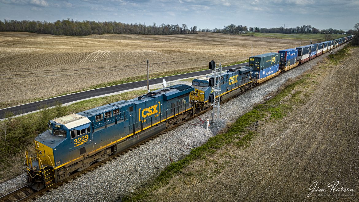 CSXT 3229 and 720 head up I028 "elephant style" as they pass through the signals and farmland at the north end of the siding at Kelly, Kentucky on April 4th, 2023, as they head northbound on the CSX Henderson Subdivision.

Tech Info: DJI Mavic 3 Classic Drone, RAW, 24mm, f/2.8, 1/1000, ISO 120.

#trainphotography #railroadphotography #trains #railways #dronephotography #trainphotographer #railroadphotographer #jimpearsonphotography #kentuckytrains #csx #csxrailway #TrentonKy #mavic3classic #drones #trainsfromtheair #trainsfromadrone #csxhendersonsubdivison