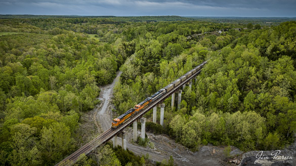 An empty BNSF 4 Rivers empty coal train passes over the bridge next to the Southern Illinois Stone Company as it heads north on April 21st, 2023, on the UP Marion/BNSF Beardstown Subdivision at Goreville, Illinois, under stormy skies.

Tech Info: DJI Mavic 3 Classic Drone, RAW, 24mm, f/2.8, 1/240 sec, ISO 120.

#trainphotography #railroadphotography #trains #railways #dronephotography #trainphotographer #railroadphotographer #jimpearsonphotography #BNSFtrains #mavic3classic #drones #trainsfromtheair #trainsfromadrone #GorevilleIL #coaltrain #BNSF #southernillinoistrains