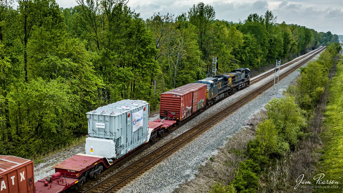 CSX M512 pulls onto track 2 as it heads north from Romney at Nortonville, Ky with an oversized load at Nortonville, Kentucky on April 28th, 2023, on the Henderson Subdivision. The load is a transformer built by Royal Smit Transformers, whose home office is in Nijmegen, Netherlands. Not sure if it was built there or here in the USA.

Tech Info: DJI Mavic 3 Classic Drone, RAW, 24mm, f/2.8, 1/1000, ISO 200.

#trainphotography #railroadphotography #trains #railways #dronephotography #trainphotographer #railroadphotographer #jimpearsonphotography #kentuckytrains #KellyKy #mavic3classic #drones #trainsfromtheair #trainsfromadrone #csxhendersonsubdivision #nortonvillekentucky