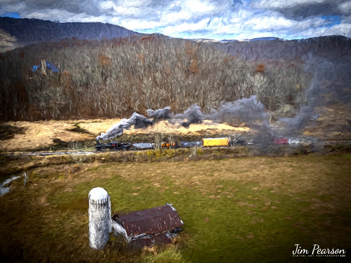 DIGITAL PHOTO ART - Meadow River Lumber Company steam locomotive, Heisler No. 6, leads a freight train past an old barn at Hosterman, West Virginia during the Mountain Rail WV, Rail Heritage Photography Weekend on November 4th, 2022. The event was held at the Durbin & Greenbrier Valley Railroad, Durbin, WV, and Cass Scenic Railroad, Cass, WV, from November 4-6th, 2022. 

According to Wikipedia: The Durbin and Greenbrier Valley Railroad (reporting mark DGVR) is a heritage and freight railroad in the U.S. states of Virginia and West Virginia. It operates the West Virginia State Rail Authority-owned Durbin Railroad and West Virginia Central Railroad (reporting mark WVC), as well as the Shenandoah Valley Railroad in Virginia.

Beginning in 2015, DGVR began operating the historic geared steam-powered Cass Scenic Railroad, which was previously operated by the West Virginia Division of Natural Resources as part of Cass Scenic Railroad State Park.

Tech Info: DJI Mavic Air 2S Drone, 22mm, f/2.8, 1/1000, ISO 200.

#trainphotography #railroadphotography #trains #railways #dronephotography #trainphotographer #railroadphotographer #jimpearsonphotography #cassscenicrailway #durbinandgreenbriervalleyrr #trainsfromtheair	#steamtrains
