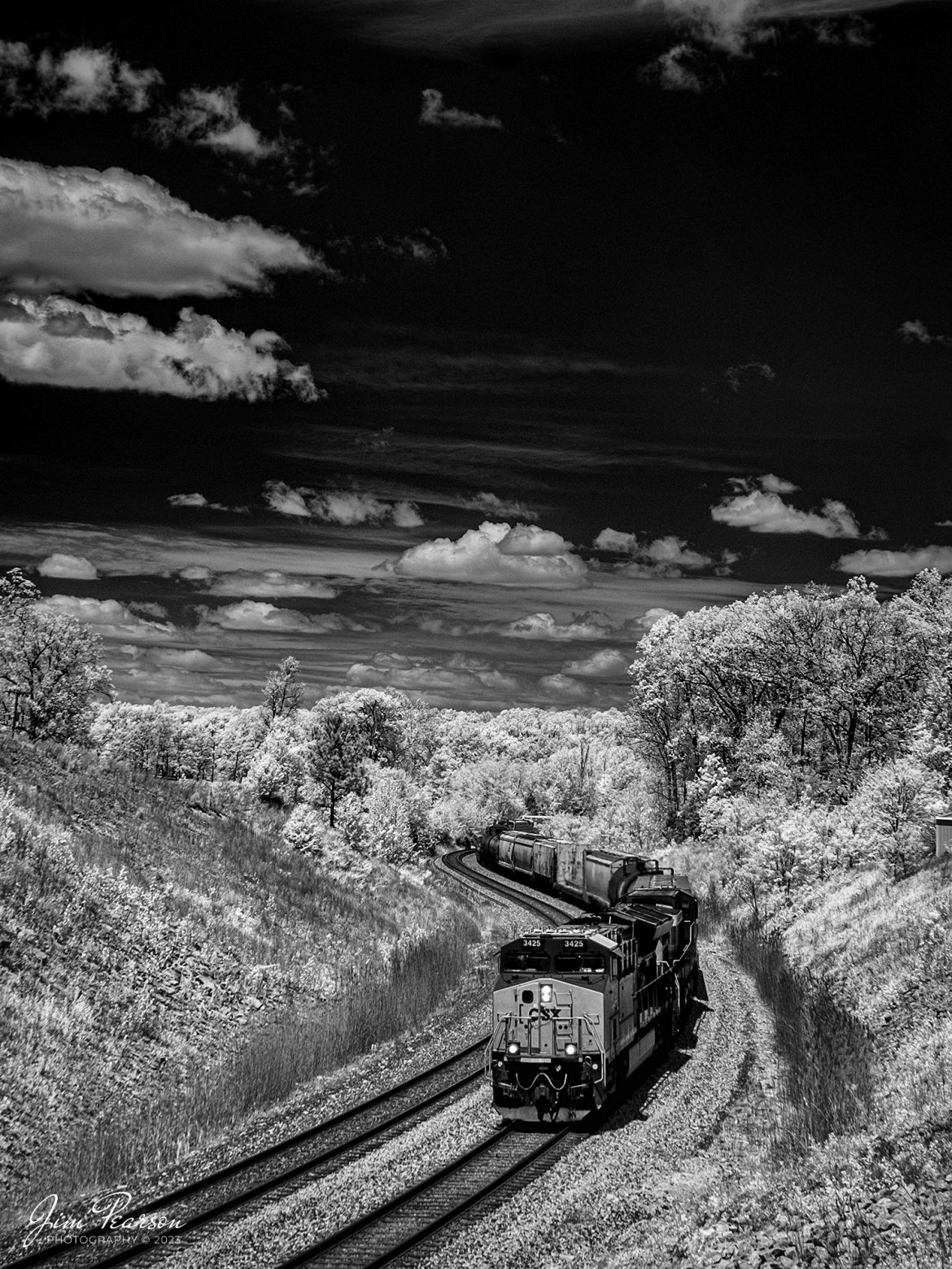This week’s Saturday Infrared photo is of CSX M647 as it passes through the S curve at Nortonville, Ky as they head south on the CSX Henderson Subdivision on May 2nd, 2023. This train runs daily between Clearing Yard at Chicago, IL, and Rice Yard at Waycross, GA.

Tech Info: Fuji XT-1, RAW, Converted to 720nm B&W IR, Sigma 24-70mm @32mm, f/5, 1/500, ISO 200.

#trainphotography #railroadphotography #trains #railways #jimpearsonphotography #infraredtrainphotography #infraredphotography #trainphotographer #railroadphotographer #csxrailroad #csxhendersonsubdivision