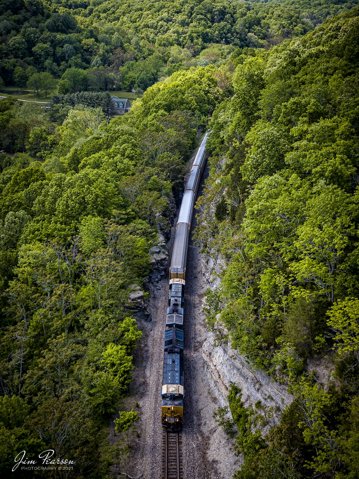 CSX 3314 leads I025 south after recently exiting Baker Tunnel at Ridgetop, Tennessee on May 6th, 2023, on the Henderson Subdivision. This train carries a string of autoracks filled with Teslas in addition to its normal train of intermodal containers as it makes its way to Jacksonville, Florida from Chicago, Illinois. 

Tech Info: DJI Mavic 3 Classic Drone, RAW, 24mm, f/2.8, 1/500, ISO 100.

#trainphotography #railroadphotography #trains #railways #dronephotography #trainphotographer #railroadphotographer #jimpearsonphotography #BNSFtrains #mavic3classic #drones #trainsfromtheair #trainsfromadrone #CSXT #TennesseeHills #CSXInternmadal #tennesseetrains