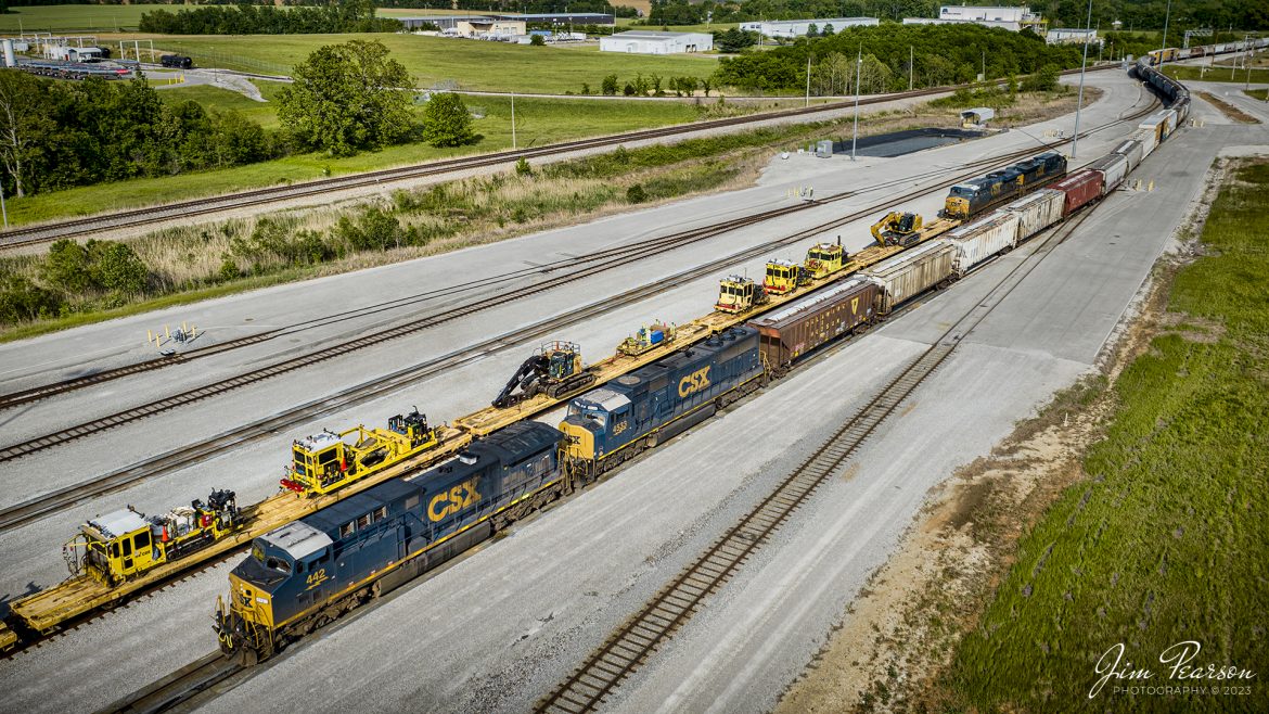 CSX M512 pulls past L392 with a load of MOW equipment, as they pull into the south end of CSX Casky yard to perform a pickup of truck frames at Hopkinsville, Kentucky on May 6th, 2023, on the Henderson Subdivision.

Tech Info: DJI Mavic 3 Classic Drone, RAW, 24mm, f/2.8, 1/1250, ISO 100.

#trainphotography #railroadphotography #trains #railways #dronephotography #trainphotographer #railroadphotographer #jimpearsonphotography #PALtrains #mavic3classic #drones #trainsfromtheair #trainsfromadrone #kentuckytrains