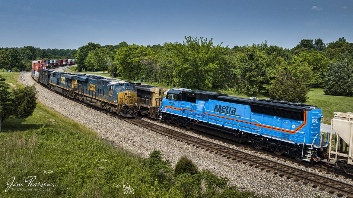 CSX I025 heads south at Kelly, Kentucky, where it meets M648 in the siding with the third unit being newly rebuilt Metra 506, dead in tow on the Henderson Subdivision, waiting to move on north to Chicago, Illinois, on May 25th, 2023.

According to The Diesel Shop website this unit is a SD70MAC that was rebuilt by Progress Rail. It is one of 14 units being rebuilt by Progress with AC traction, geared for 80 mph, HEP, microprocessor-control braking and Tier 3 emissions.

Tech Info: DJI Mavic 3 Classic Drone, RAW, 24mm, f/2.8, 1/1600, ISO 100.

#trainphotography #railroadphotography #trains #railways #dronephotography #trainphotographer #railroadphotographer #jimpearsonphotography #CSXtrains #mavic3classic #drones #trainsfromtheair #trainsfromadrone #Metra #CSXHendersonsubdivision #KellyKy