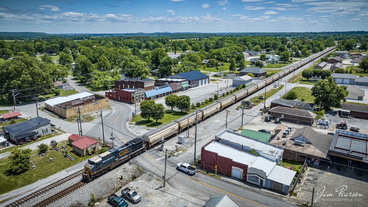 CSXT 5111 leads G388, an empty grain express train through downtown Crofton, Ky on May 29th, 2023, as they head north on the Henderson Subdivision on a beautiful sprint afternoon.

Tech Info: DJI Mavic 3 Classic Drone, RAW, 24mm, f/2.8, 2000, ISO 100.

#trainphotography #railroadphotography #trains #railways #dronephotography #trainphotographer #railroadphotographer #jimpearsonphotography #trains #csx #csxrailway #kentuckytrains #mavic3classic #drones #trainsfromtheair #trainsfromadrone #graintrain