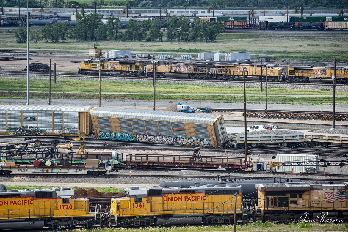 During my recent cross-country trip to Washington state, I stopped off at the Golden Spike Tower, in North Platte, Nebraska on Jun 17th, 2023, and caught this Union Pacific freight heading through the yard as it passed a minor derailment in the Bailey yard there from the top of the tower. The tower makes for a great shooting platform with the right lenses.

According to Wikipedia: Bailey Yard is the world's largest railroad classification yard. Employees sort, service and repair locomotives and cars headed across North America. Owned and operated by the Union Pacific Railroad (UP), Bailey Yard is in North Platte, Nebraska. The yard is named after former Union Pacific president Edd H. Bailey.

Tech Info: Nikon D800, RAW, Nikon 70-300mm @135mm, f/5.6, 1/1250, ISO 900.

#trainphotography #railroadphotography #trains #railways #dronephotography #trainphotographer #railroadphotographer #jimpearsonphotography #UPtrains #NikonD800 #UnionPacific #WyomingTrains #UnionPacific #UP