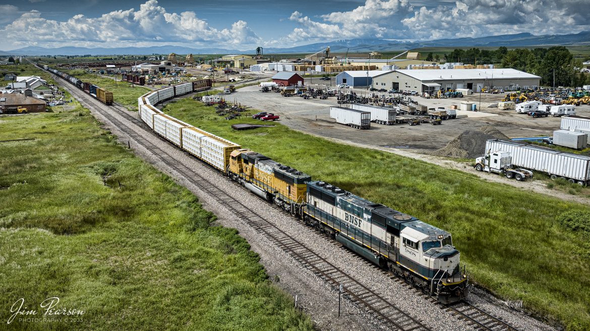 BNSF 9808 and 8843, lead a mixed freight as they pickup a string of lumber cars at Deer Lodge, Montana, on June 26th, 2023, before continuing north on the Copper City Subdivision.

Tech Info: DJI Mavic 3 Classic Drone, RAW, 24mm, f/2.8, 1/2000, ISO 100.

#trainphotography #railroadphotography #trains #railways #dronephotography #trainphotographer #railroadphotographer #jimpearsonphotography #trains #bnsf #mavic3classic #drones #trainsfromtheair #trainsfromadrone # MontanaTrains