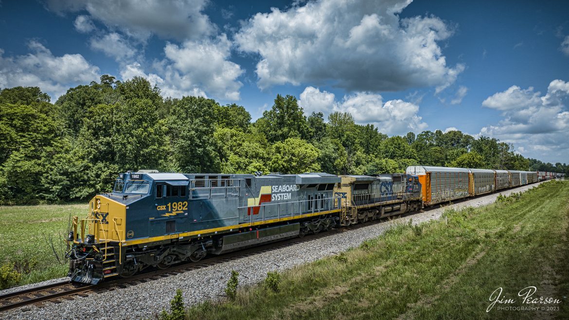 One of the new CSX Heritage series locomotives, the Seaboard System unit 1982, lead on CSX I025 as it headed south just out of Sebree, Ky, on July 6th, 2023 along the Henderson Subdivision.

According to Wikipedia: The Seaboard System Railroad, Inc. (reporting mark SBD) was a US Class I railroad that operated from 1982 to 1986.

Since the late 1960s, Seaboard Coast Line Industries had operated the Seaboard Coast Line and its sister railroadsnotably the Louisville & Nashville and Clinchfieldas the "Family Lines System". In 1980, SCLI merged with the Chessie System to create the holding company CSX Corporation; two years later, CSX merged the Family Lines railroads to create the Seaboard System Railroad.

In 1986, Seaboard renamed itself CSX Transportation, which absorbed the Chessie System's two major railroads the following year.

Tech Info: DJI Mavic 3 Classic Drone, RAW, 24mm, f/2.8, 1/2000, ISO 120.

#trainphotography #railroadphotography #trains #railways #dronephotography #trainphotographer #railroadphotographer #jimpearsonphotography #trains #csxt #mavic3classic #drones #trainsfromtheair #trainsfromadrone #CSXHeritageUnits