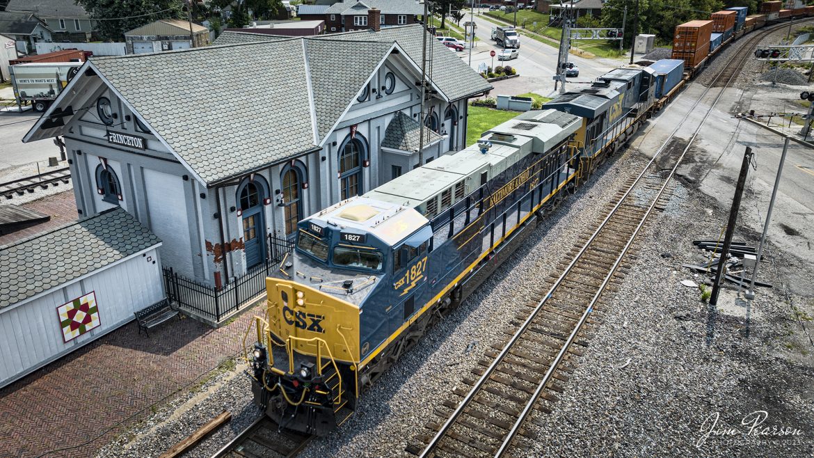 One of the new CSX Heritage series locomotives, the Baltimore & Ohio unit 1827, leads CSX hot intermodal I028 as it makes its way past the old depot at Princeton, Indiana, on July 17th, 2023, as it heads north on the CSX CE&D Subdivision.

The station was built in 1875 and has been beautifully restored. It served the C&EI and L&N railways during its day and was the lifeline of commerce and transportation for the county. Passenger service was discontinued in the late 1960s and today it is home to the Gibson County Visitors Center and features a railway museum with a restored Wabash caboose.

According to Wikipedia: The Baltimore and Ohio Railroad was the first common carrier railroad and the oldest railroad in the United States with its first section opening in 1830.

The Chesapeake and Ohio Railway took financial control of the B&O in 1963.[52] On May 1, 1971, Amtrak had taken over all the remaining non-commuter routes of the B&O. The B&O already had a controlling interest in the Western Maryland Railway. In 1973 the three railroads were brought together under one corporate identity, the Chessie System, although they continued to operate as separate railroads. 

In 1980 the Chessie System and Seaboard Coast Line Industries, a holding company that owned the Seaboard Coast Line, the Louisville & Nashville, the Clinchfield, and the Georgia Railroad, agreed to form CSX Corporation. SCL Industries was renamed the Seaboard System Railroad (SBD) in 1983, the same year that the Western Maryland Railway was completely absorbed into the B&O. SBD was renamed CSX Transportation (CSX) in 1986. On April 30, 1987, the B&O's corporate existence ended when it was absorbed into the Chesapeake and Ohio Railway, which merged into CSX Transportation on August 31 of that year.

Tech Info: DJI Mavic 3 Classic Drone, RAW, 24mm, f/2.8, 1/2000, ISO 210.

#trainphotography #railroadphotography #trains #railways #dronephotography #trainphotographer #railroadphotographer #jimpearsonphotography #trains #csxt #mavic3classic #drones #trainsfromtheair #trainsfromadrone #CSXHeritageUnits