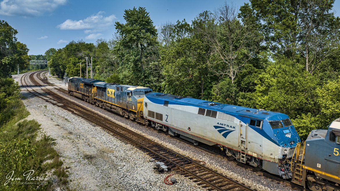 CSX M512 heads toward Howell yard from the location called Hybrid at Evansville, Indiana with Amtrak #2 in tow as it’s third unit of five on the Henderson Subdivision on July 17th, 2023. The Amtrak locomotive was recently damaged when it struck a semi-truck carrying automobiles, injuring seven people as it passed through Lakeland, Florida on July 14th. The damage can be seen on the nose of #2 in this photo.

Tech Info: DJI Mavic 3 Classic Drone, RAW, 24mm, f/2.8, 1/1600, ISO 120.

#trainphotography #railroadphotography #trains #railways #dronephotography #trainphotographer #railroadphotographer #jimpearsonphotography #trains #csxt #mavic3classic #drones #trainsfromtheair #trainsfromadrone #amtrak