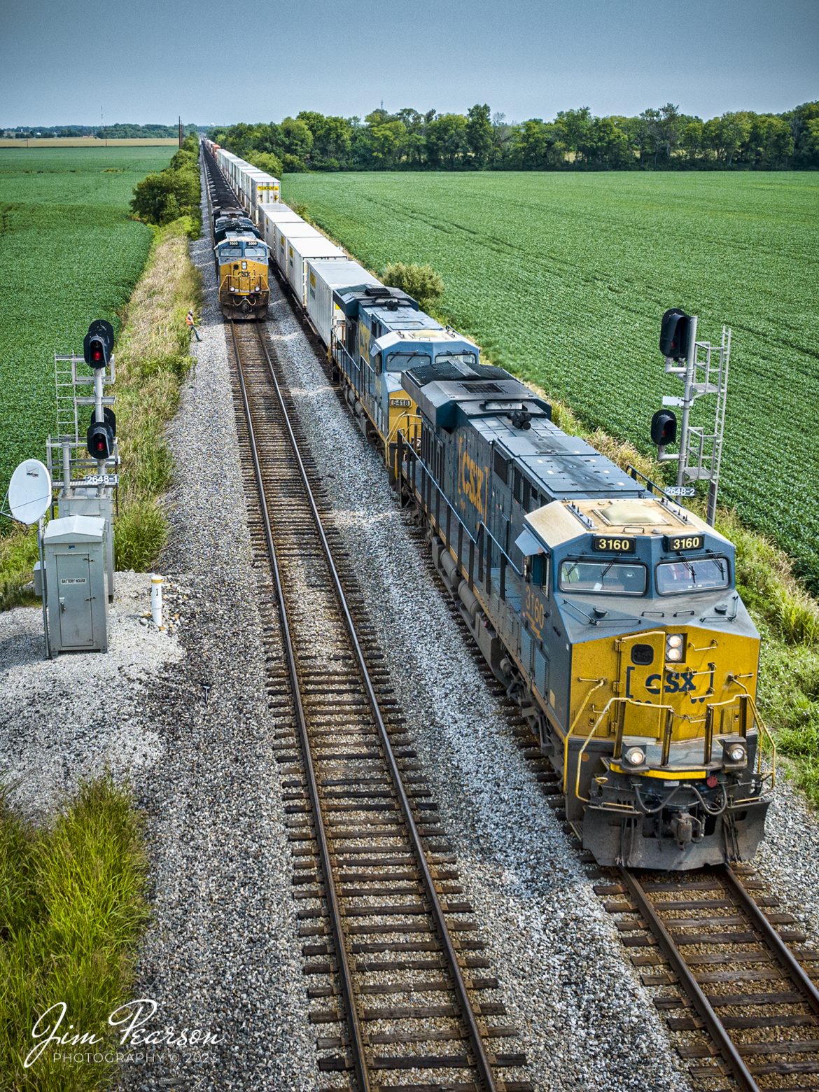CSXT 3160 and 5418 lead CSX hot intermodal I025 southbound as they pass a loaded coal train, toward the south end of King, outside of Ft. Branch, IN on the CE&D Subdivision on July 17th, 2023.

Tech Info: DJI Mavic 3 Classic Drone, RAW, 24mm, f/2.8, 1/1600, ISO 140.

#trainphotography #railroadphotography #trains #railways #dronephotography #trainphotographer #railroadphotographer #jimpearsonphotography #trains #csxt #mavic3classic #drones #trainsfromtheair #trainsfromadrone