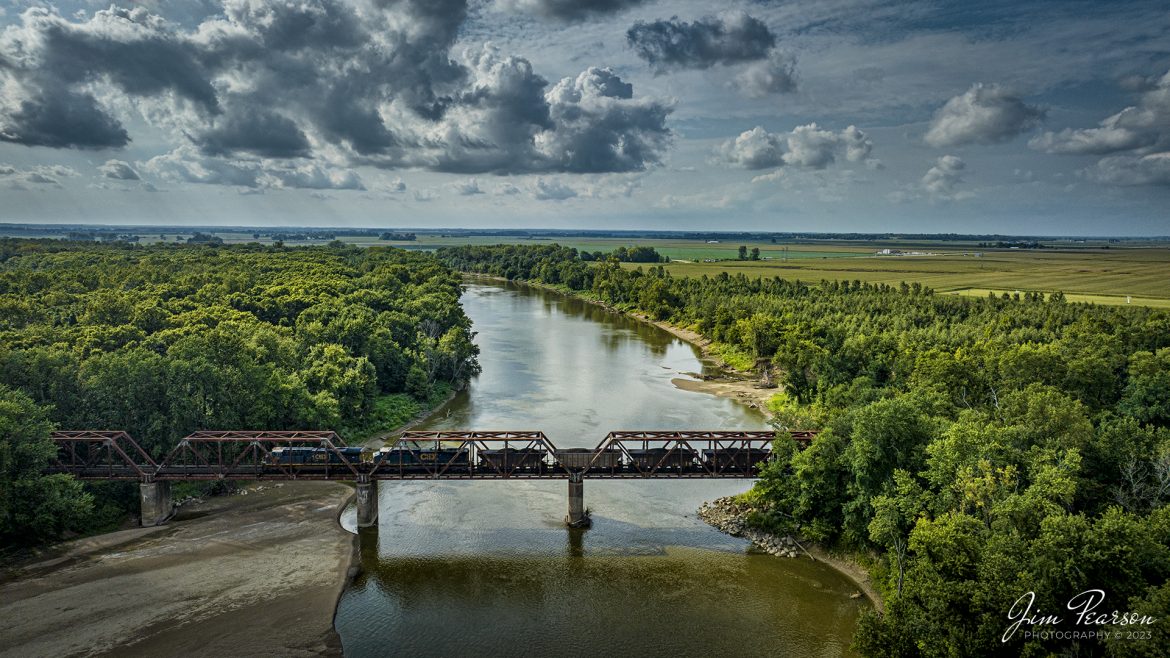 CSXT 894 heads up R567, a loaded coal train, headed south from the coal loop at Oaktown, Indiana on the CSX CE&D Subdivision, as it crosses over the White River at Decker, Indiana on August 26th, 2023.

Tech Info: DJI Mavic 3 Classic Drone, RAW, 24mm, f/2.8, 1/4000, ISO 210.

#trainphotography #railroadphotography #trains #railways #dronephotography #trainphotographer #railroadphotographer #jimpearsonphotography #trains #mavic3classic #drones #trainsfromtheair #trainsfromadrone #Indianatrains #coaltrains