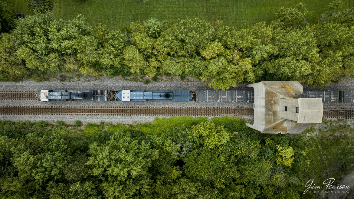 CSX X503 passes under the old Louisville and Nashville coaling tower at Sullivan, Indiana as it heads south on the CSX CE&D Subdivision on August 26th, 2023.

Tech Info: DJI Mavic 3 Classic Drone, RAW, 24mm, f/2.8, 1/400, ISO 100.

#trainphotography #railroadphotography #trains #railways #dronephotography #trainphotographer #railroadphotographer #jimpearsonphotography #trains #mavic3classic #drones #trainsfromtheair #trainsfromadrone #Indianatrains
