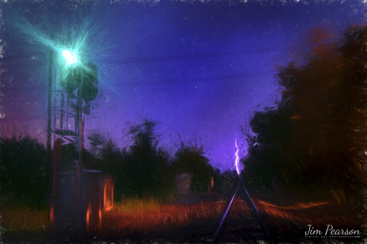 Digital Photo Art – The Paducah and Louisville Railway signal at Richland, Kentucky glows green for a southbound train as a lightning bolt strikes at the vanishing point of the tracks and lights up the sky, as a storm rolls into the area on July 13th, 2011.

Tech Info: Nikon D800, Nikon 18mm, f/2.8, 30 seconds, ISO 200.

#trainphotography #railroadphotography #trains #railways #trainphotographer #railroadphotographer #jimpearsonphotography #digitalphotoart
