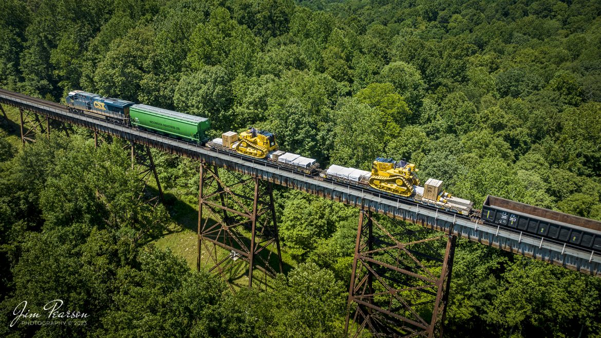 CSX M513 makes their way across Gum Lick Trestle, approaching Kelly, Ky, with two brand new large Caterpillar D11 Dozers at the front of their train, as it heads south on the Henderson Subdivision on July 31st, 2023.

Tech Info: DJI Mavic 3 Classic Drone, RAW, 24mm, f/2.8, 1/500, ISO 100.

#trainphotography #railroadphotography #trains #railways #dronephotography #trainphotographer #railroadphotographer #jimpearsonphotography #trains #csxt #mavic3classic #drones #trainsfromtheair #trainsfromadrone