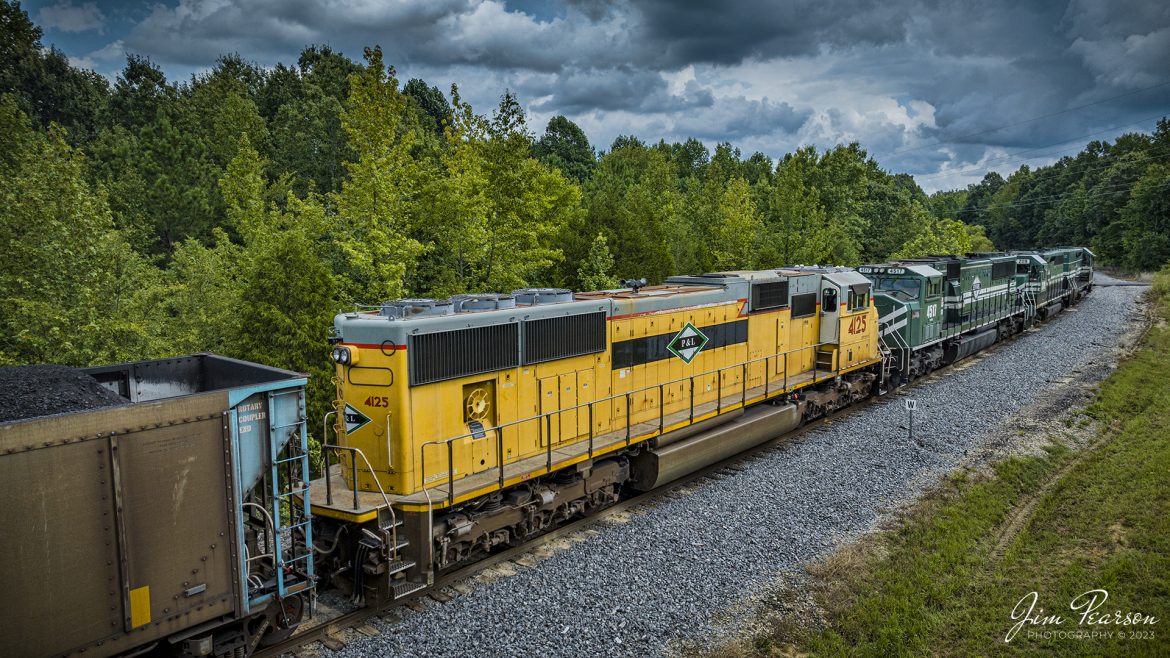 A Paducah and Louisville Railway (PAL) loaded coal train heads down the Warrior Coal Loop lead with a newly acquired Union Pacific SD70M 4125 as the trailing unit at Madisonville, Ky on August 13th, 2023.

Tech Info: DJI Mavic 3 Classic Drone, RAW, 24mm, f/2.8, 1/1600, ISO 180.

#trainphotography #railroadphotography #trains #railways #dronephotography #trainphotographer #railroadphotographer #jimpearsonphotography #trains #csxt #mavic3classic #drones #trainsfromtheair #trainsfromadrone #MadisonvilleKy