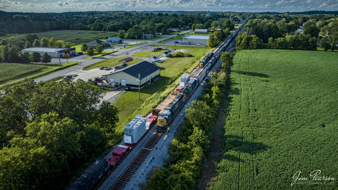 CSX M512 meets CSX B795 at the north end of the siding at Crofton, Ky on August 14th, 2023, as it heads north on the Henderson Subdivision with two high/wide transformers as part of their cargo. Here it passes the ethanol train as the conductor and his trainee do a roll by inspection as M512 rolls by with a 10mph speed restriction.

Tech Info: DJI Mavic 3 Classic Drone, RAW, 24mm, f/2.8, 1/2500, ISO 300.

#trainphotography #railroadphotography #trains #railways #dronephotography #trainphotographer #railroadphotographer #jimpearsonphotography #trains #csxt #mavic3classic #drones #trainsfromtheair #trainsfromadrone #CroftonKy