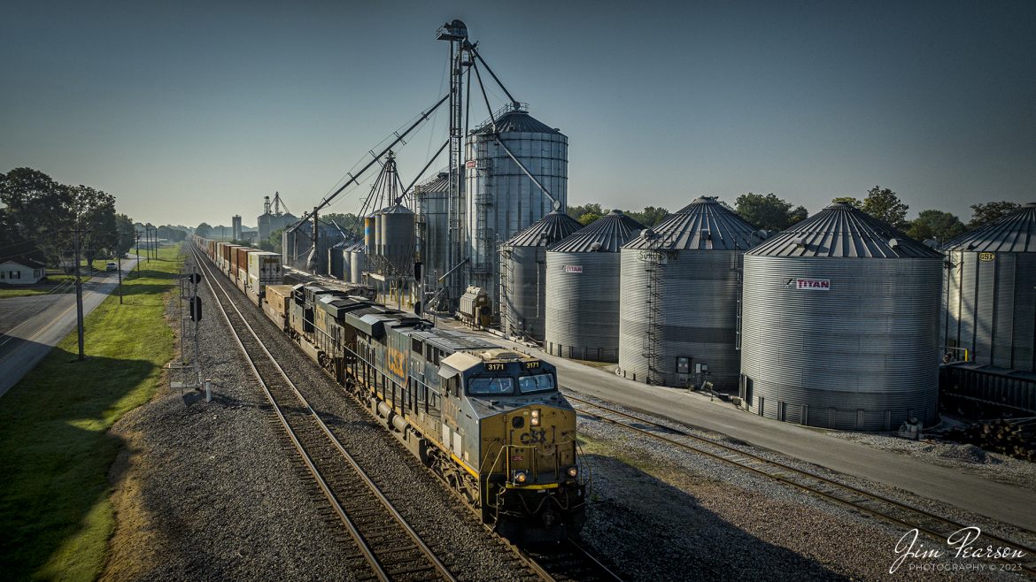 An early morning CSX I028 heads northbound through Trenton, Kentucky on August 24th, 2023, as it passes the WF Ware grain facility.

Tech Info: DJI Mavic 3 Classic Drone, RAW, 24mm, f/2.8, 1/5000, ISO 240.

#trainphotography #railroadphotography #trains #railways #dronephotography #trainphotographer #railroadphotographer #jimpearsonphotography #trains #mavic3classic #drones #trainsfromtheair #trainsfromadrone #CSXHendersonSubdivision #trentonky #kentuckytrains