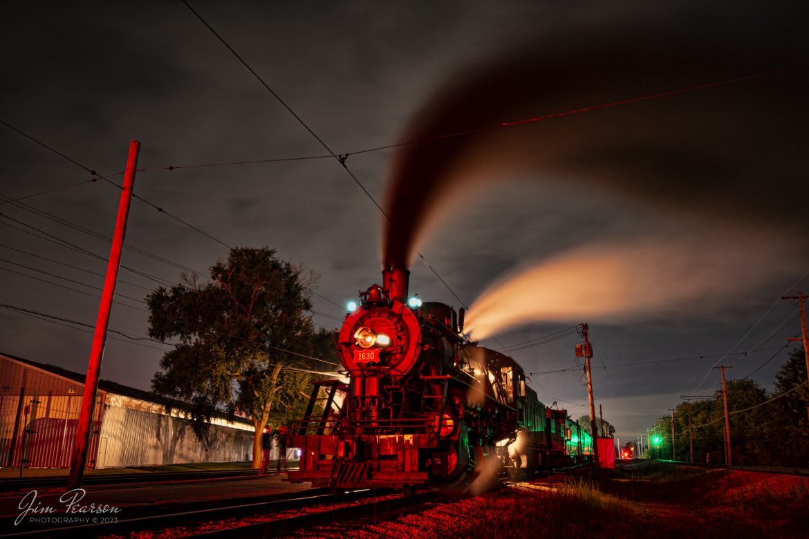 Colorful light from signals along with the smoke from Steam locomotive Frisco 1630 help provide a dramatic night photo as it sits in the station at the Illinois Railway Museum (IRM) during their 70th anniversary weekend in Union, Illinois, waiting to depart on the evening of September 16th, 2023. 

According to IRM website: St. Louis  San Francisco Railroad (Frisco) 1630 is the museums most famous steam engine. A Russian Decapod, it was built in 1918 for export to Russia but was embargoed when the Bolshevik Revolution took place. Instead, the newly completed engine was sold to the Frisco, which used it in both freight and passenger service into the 1950s. The Frisco later sold it to Eagle-Picher Mining, where it saw use hauling freight and aggregate trains until the mid-1960s. It arrived at the IRM in 1967.

Tech Info: Nikon D800, RAW, Nikon 10-24 @15mm, f/4, 30 Seconds, ISO 100.

#trainphotography #railroadphotography #trains #railways #dronephotography #trainphotographer #railroadphotographer #jimpearsonphotography #NikonD800 #IllinoisRailwayMuseum #Frisco1630 #trainsatnight #illinoistrains #steamtrains#IllinoisRailwayMuseum #trainsinbadweather #illinoistrains #steamtrain #trainsatnight
