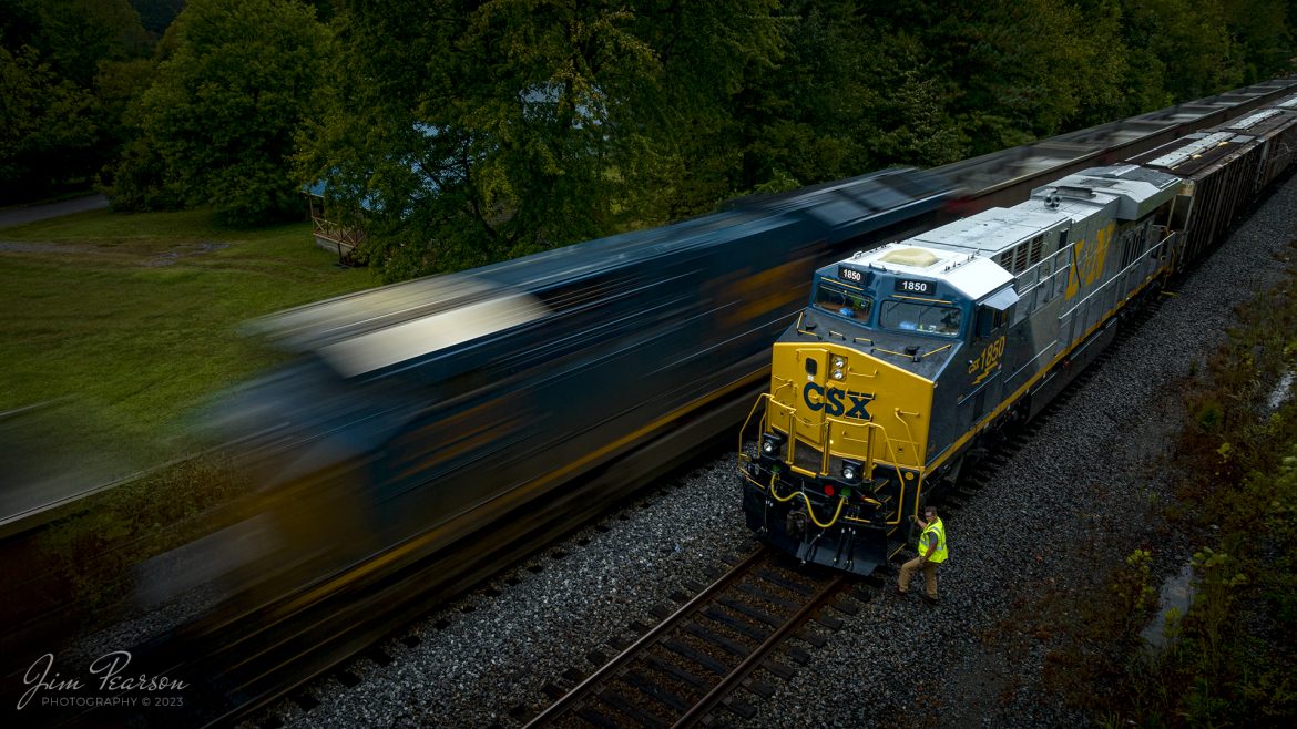 The late evening light and rainy weather helped bring about this slow shutter speed shot of the conductor on G419, with the latest CSX Heritage Unit, L&N 1850 leading his loaded grain train, doing a roll-by inspection on empty coal train E904 at the south end of the siding at Slaughters, Kentucky on October 5th, 2023, on the Henderson Subdivision, trackage that used to belong to the L&N.

Ive been trying for several days to get a good shot of this engine, as its been at Howell Yard in Evansville, IN for their Family Days event. I didnt want a shot of it just sitting in a yard, so I played the long game and made two-day long trips to Indiana to get it finally on the move! I started the chase on this move at Princeton, IN this was my last shot of the day! It rained pretty much the whole day, but fortunately there was a lull here and a couple of other spots where I was able to get the drone up!

According to CSXT: CSX has introduced the sixth locomotive in its heritage series, a freshly painted unit honoring the Louisville & Nashville Railroad. Designated CSX 1850, the locomotive will be placed into service, carrying the L&N colors across the 20,000-mile CSX network.

The paint scheme was designed and applied at the CSX Locomotive Shop in Waycross, Georgia, which has produced all six units in the heritage series celebrating the lines that came together to form the modern CSX. Like the other heritage locomotives, the L&N unit combines the heritage railroads iconic logo and colors on the rear two-thirds of the engine with todays CSX colors and markings on the cab end.

Chartered by the State of Kentucky in 1850, the L&N grew into a vital transportation link between the Gulf Coast and the nations heartland. The railroad was absorbed by the Seaboard Coast Line Railroad, which subsequently became part of the Chessie System and, ultimately, todays CSX.

The CSX heritage series is reinforcing employee pride in the history of the railroad that continues to move the nations economy with safe, reliable and sustainable rail-based transportation services.

Tech Info: DJI Mavic 3 Classic Drone, RAW, 22mm, f/8, 1/10, ISO 100.

#trainphotography #railroadphotography #trains #railways #jimpearsonphotography #trainphotographer #railroadphotographer #CSXHeritage #SlaughtersKy #dronephoto #trainsfromadrone #KyTrains