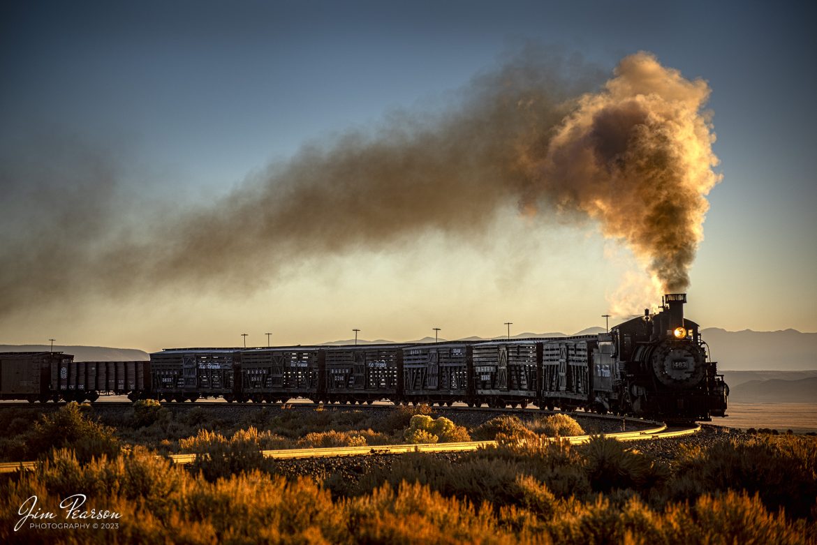 The glow of the rising sun illuminates Cumbres & Toltec Scenic Railroad steam locomotive D&RGW 463 as it leads an early morning freight west approaching Lata water tank, out of Antonito, Colorado, during a photo charter by Dak Dillon Photography on October19th, 2023.

According to their website: the Cumbres & Toltec Scenic Railroad is a National Historic Landmark.  At 64-miles in length, it is the longest, the highest and most authentic steam railroad in North America, traveling through some of the most spectacular scenery in the Rocky Mountain West.

Owned by the states of Colorado and New Mexico, the train crosses state borders 11 times, zigzagging along canyon walls, burrowing through two tunnels, and steaming over 137-foot Cascade Trestle. All trains steam along through deep forests of aspens and evergreens, across high plains filled with wildflowers, and through a rocky gorge of remarkable geologic formations. Deer, antelope, elk, fox, eagles and even bear are frequently spotted on this family friendly, off-the grid adventure.

Tech Info: Nikon D810, RAW, Nikon 70-300 @ 125mm, f/4.8, 1/2000, ISO 450.

railroad, railroads train, trains, best photo. sold photo, railway, railway, sold train photos, sold train pictures, steam trains, rail transport, railroad engines, pictures of trains, pictures of railways, best train photograph, best photo, photography of trains, steam train photography, sold picture, best sold picture, Jim Pearson Photography, Cumbres & Toltec Scenic Railroad
