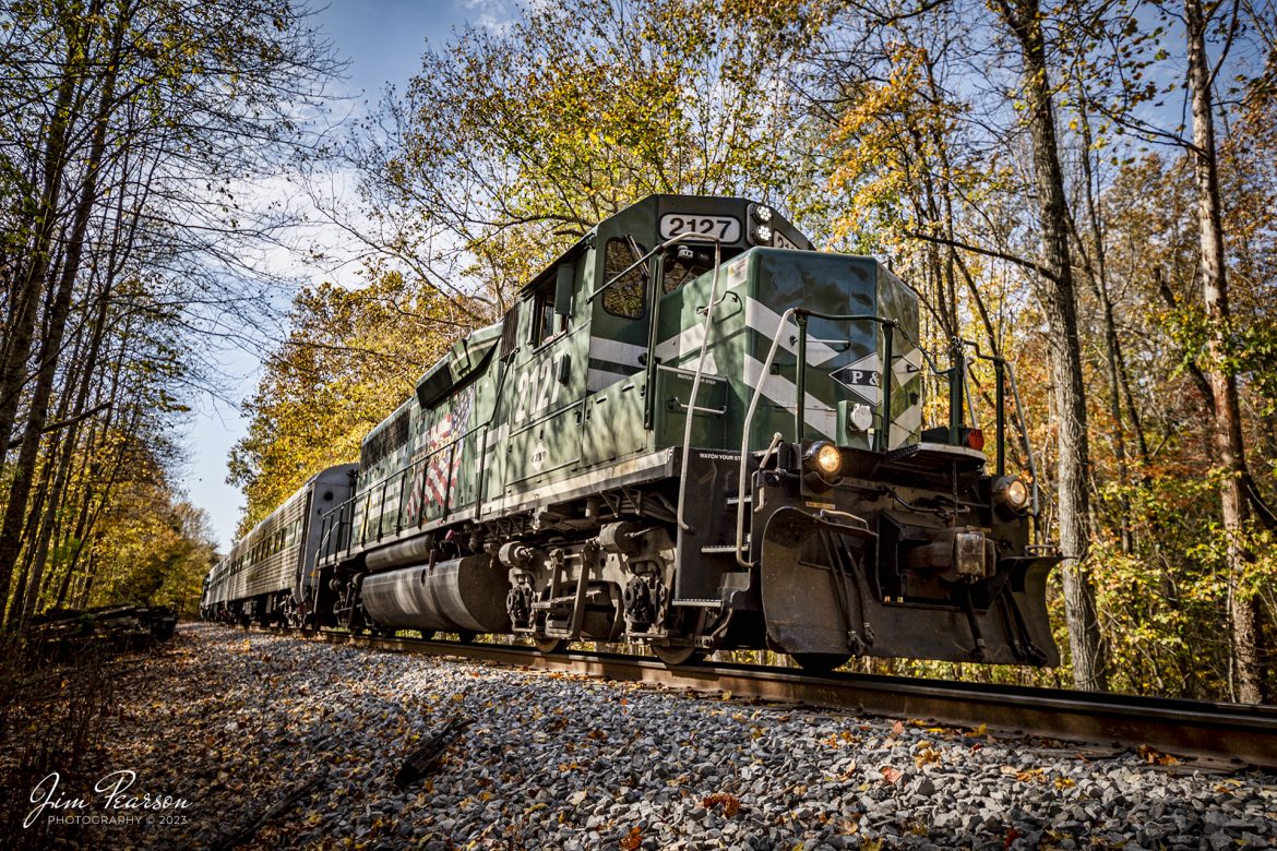 Paducah and Louisville Railway's Salute the Troops locomotive sits in the fall forest just south of Dawson Springs, Kentucky as it prepares to start the return trip to West Yard in Madisonville, during an Operation Lifesaver event I was invited to join on October 25th, 2023. It was a great experience to ride on their Bluegrass State I and II along with the other officials and emergency responders.

Tech Info: Nikon D810, RAW, Nikon 10-24 @ 17mm, f/4.2, 1/500, ISO 64.

#trainphotography #railroadphotography #trains #railways #trainphotographer #railroadphotographer #jimpearsonphotography #NikonD810 #KentuckyTrains #OLS #PAL