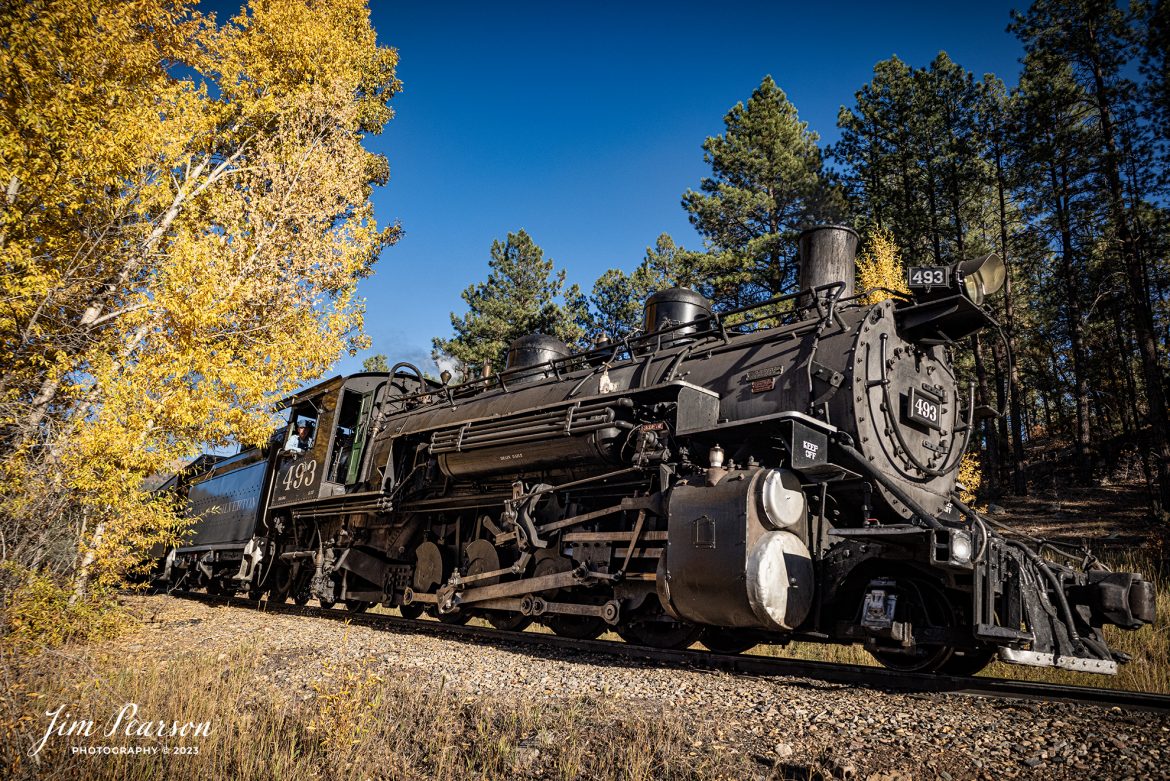 Denver and Rio Grande Western steam locomotive 493 heads up a daily passenger train as they pull from the station at Rockwood, Colorado, as they head back to Durango after their trip to Silverton, CO, on October 14th, 2023. 

According to Wikipedia: The Durango and Silverton Narrow Gauge Railroad, often abbreviated as the D&SNG, is a 3 ft (914 mm) narrow-gauge heritage railroad that operates on 45.2 mi (72.7 km) of track between Durango and Silverton, in the U.S. state of Colorado. The railway is a federally designated National Historic Landmark and was also designated by the American Society of Civil Engineers as a National Historic Civil Engineering Landmark in 1968.

Tech Info: Nikon D810, RAW, Sigma 24-70 @ 24mm, f/5.6, 1/1250, ISO 400.

railroad, railroads train, trains, best photo. sold photo, railway, railway, sold train photos, sold train pictures, steam trains, rail transport, railroad engines, pictures of trains, pictures of railways, best train photograph, best photo, photography of trains, steam, train photography, sold picture, best sold picture, Jim Pearson Photography, Durango and Silverton Narrow Guage Railroad, steam train, drgwrr
