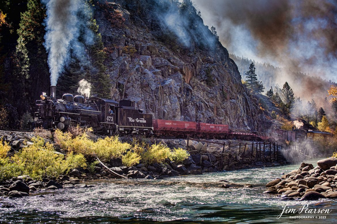 Durango and Silverton Narrow Gauge steam locomotive D&RGW 473 leads a K-28 100th Anniversary Special with D&RGW 476 as a mid-train helper through the Repeating Curves at MP 472.2, along the Animas River, between Durango and Silverton, Colorado, on October 16th, 2023.

According to Wikipedia: The Durango and Silverton Narrow Gauge Railroad, often abbreviated as the D&SNG, is a 3 ft (914 mm) narrow-gauge heritage railroad that operates on 45.2 mi (72.7 km) of track between Durango and Silverton, in the U.S. state of Colorado. The railway is a federally designated National Historic Landmark and was also designated by the American Society of Civil Engineers as a National Historic Civil Engineering Landmark in 1968.

Tech Info: Nikon D810, RAW, Sigma 24-70 @ 70mm, f/5.6, 1/1000, ISO 72.

railroad, railroads train, trains, best photo. sold photo, railway, railway, sold train photos, sold train pictures, steam trains, rail transport, railroad engines, pictures of trains, pictures of railways, best train photograph, best photo, photography of trains, steam, train photography, sold picture, best sold picture, Jim Pearson Photography, Durango and Silverton Narrow Guage Railroad, steam train, drgwrr
