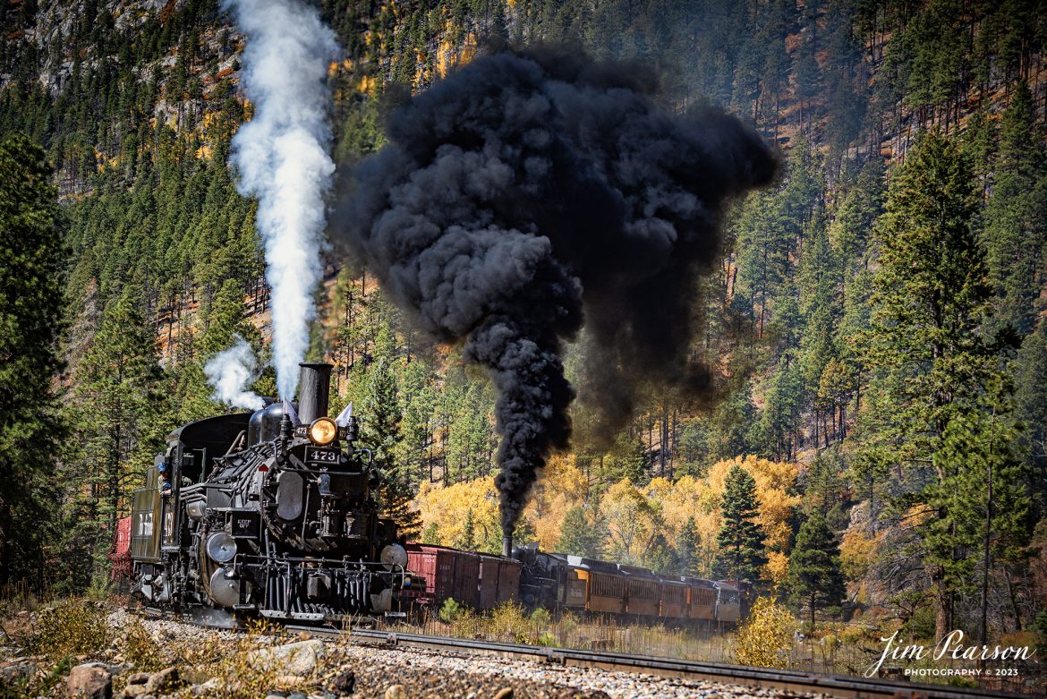 Durango and Silverton Narrow Gauge steam locomotive D&RGW 476 runs as a mid-train helper on a K-28 100th Anniversary Special as they head through the curve at Goblin Fire, Milepost 480.5, between Durango and Silverton, Colorado, on October 16th, 2023.

According to Wikipedia: The Durango and Silverton Narrow Gauge Railroad, often abbreviated as the D&SNG, is a 3 ft (914 mm) narrow-gauge heritage railroad that operates on 45.2 mi (72.7 km) of track between Durango and Silverton, in the U.S. state of Colorado. The railway is a federally designated National Historic Landmark and was also designated by the American Society of Civil Engineers as a National Historic Civil Engineering Landmark in 1968.

Tech Info: Nikon D810, RAW, Nikon 70-300 @ 95mm, f/5.6, 1/800, ISO 110.

railroad, railroads train, trains, best photo. sold photo, railway, railway, sold train photos, sold train pictures, steam trains, rail transport, railroad engines, pictures of trains, pictures of railways, best train photograph, best photo, photography of trains, steam, train photography, sold picture, best sold picture, Jim Pearson Photography, Durango and Silverton Narrow Guage Railroad, steam train, drgwrr