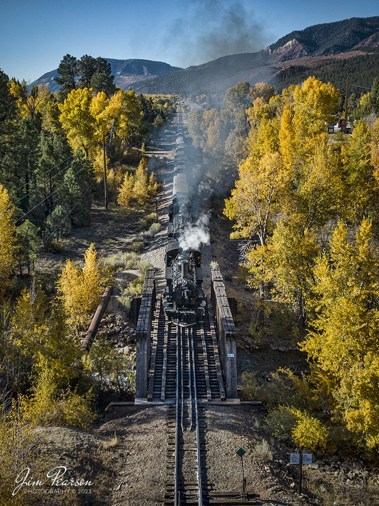 Denver and Rio Grande Western double header steam locomotives 473 and 493 pull a daily passenger train as they cross the bridge at Hermosa, Colorado on their run between Durango and Silverton, CO, on a beautiful fall day on October 18th, 2023. 

According to Wikipedia: The Durango and Silverton Narrow Gauge Railroad, often abbreviated as the D&SNG, is a 3 ft (914 mm) narrow-gauge heritage railroad that operates on 45.2 mi (72.7 km) of track between Durango and Silverton, in the U.S. state of Colorado. The railway is a federally designated National Historic Landmark and was also designated by the American Society of Civil Engineers as a National Historic Civil Engineering Landmark in 1968.

Tech Info: DJI Mavic 3 Classic Drone, RAW, 22mm, f/2.8, 1/1600, ISO 100.

railroad, railroads train, trains, best photo. sold photo, railway, railway, sold train photos, sold train pictures, steam trains, rail transport, railroad engines, pictures of trains, pictures of railways, best train photograph, best photo, photography of trains, steam, train photography, sold picture, best sold picture, Jim Pearson Photography, Durango and Silverton Narrow Guage Railroad, steam train, DRGWRR, Trains from the air, drone