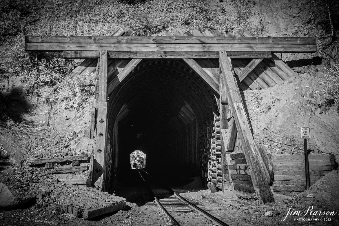 This week’s Saturday Infrared photo is of Cumbres & Toltec Scenic Railroad steam locomotive D&RGW 463 as it approaches Mud Tunnel at milepost 311.3 as it returns to Antonito from Osier, Colorado, during a photo charter by Dak Dillon Photography on October 19th, 2023.

According to their website: the Cumbres & Toltec Scenic Railroad is a National Historic Landmark.  At 64-miles in length, it is the longest, the highest and most authentic steam railroad in North America, traveling through some of the most spectacular scenery in the Rocky Mountain West.

Owned by the states of Colorado and New Mexico, the train crosses state borders 11 times, zigzagging along canyon walls, burrowing through two tunnels, and steaming over 137-foot Cascade Trestle. All trains steam along through deep forests of aspens and evergreens, across high plains filled with wildflowers, and through a rocky gorge of remarkable geologic formations. Deer, antelope, elk, fox, eagles and even bear are frequently spotted on this family friendly, off-the grid adventure.

According to History Colorado Website: Built in 1903 by the Baldwin Locomotive Works of Philadelphia, Engine No. 463 is one of only two remaining locomotives of the K-27 series originally built for and operated by the Denver & Rio Grande Western Railroad.

The K-27 series was a departure from the design most prevalent on Colorado’s narrow-gauge lines, resulting in a locomotive with one and one-half times more power.  The arrival of this series marked a significant turning point in the operation of the D&RGW’s narrow gauge lines that was to remain in effect until the end of Class I narrow gauge steam locomotion in 1968.  The Friends of the Cumbres & Toltec Scenic Railroad restored the engine to operating condition.

Tech Info: Nikon D810, RAW, Nikon 10-24 @24mm, f/5.6, 1/220, ISO 400.

#trainphotographer #railroadphotographer #jimpearsonphotography #NikonD810 #digitalphotoart #steamtrain #ColoradoSteamTrain #ctsrr
